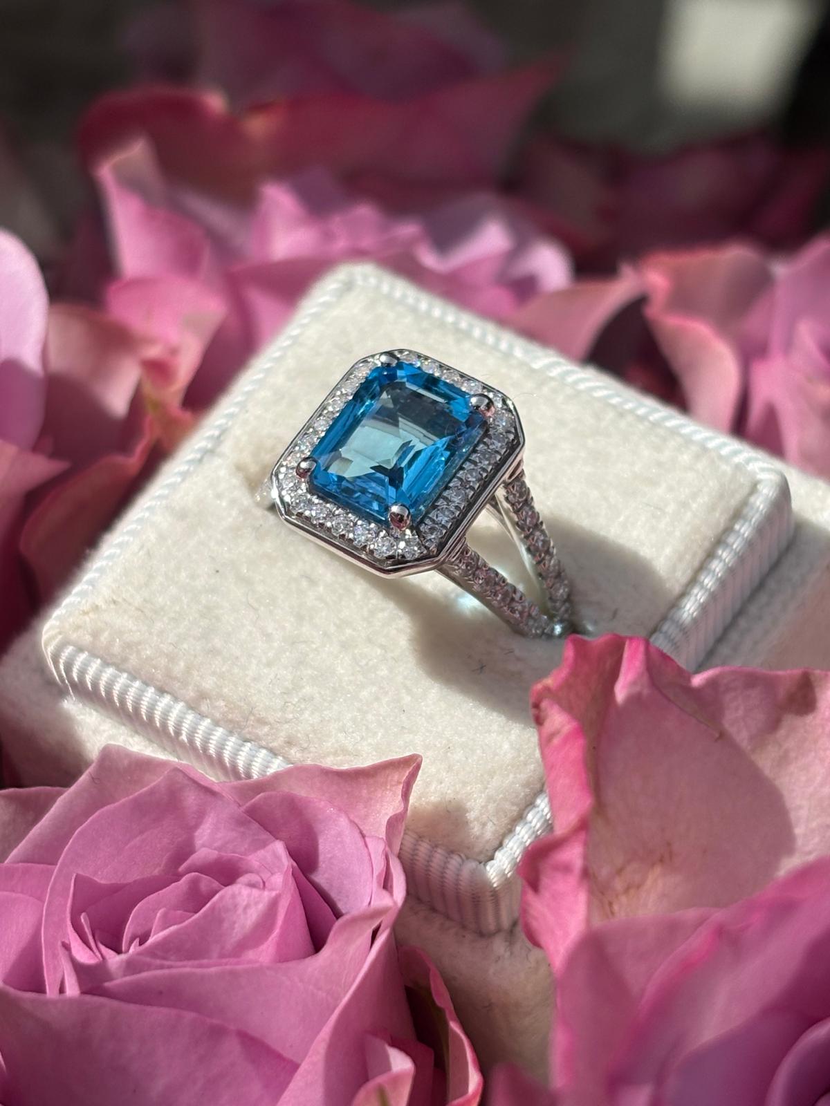 3.10 CTW Emerald Cut Moissanite and Blue Topaz Halo Ring in Sterling Silver