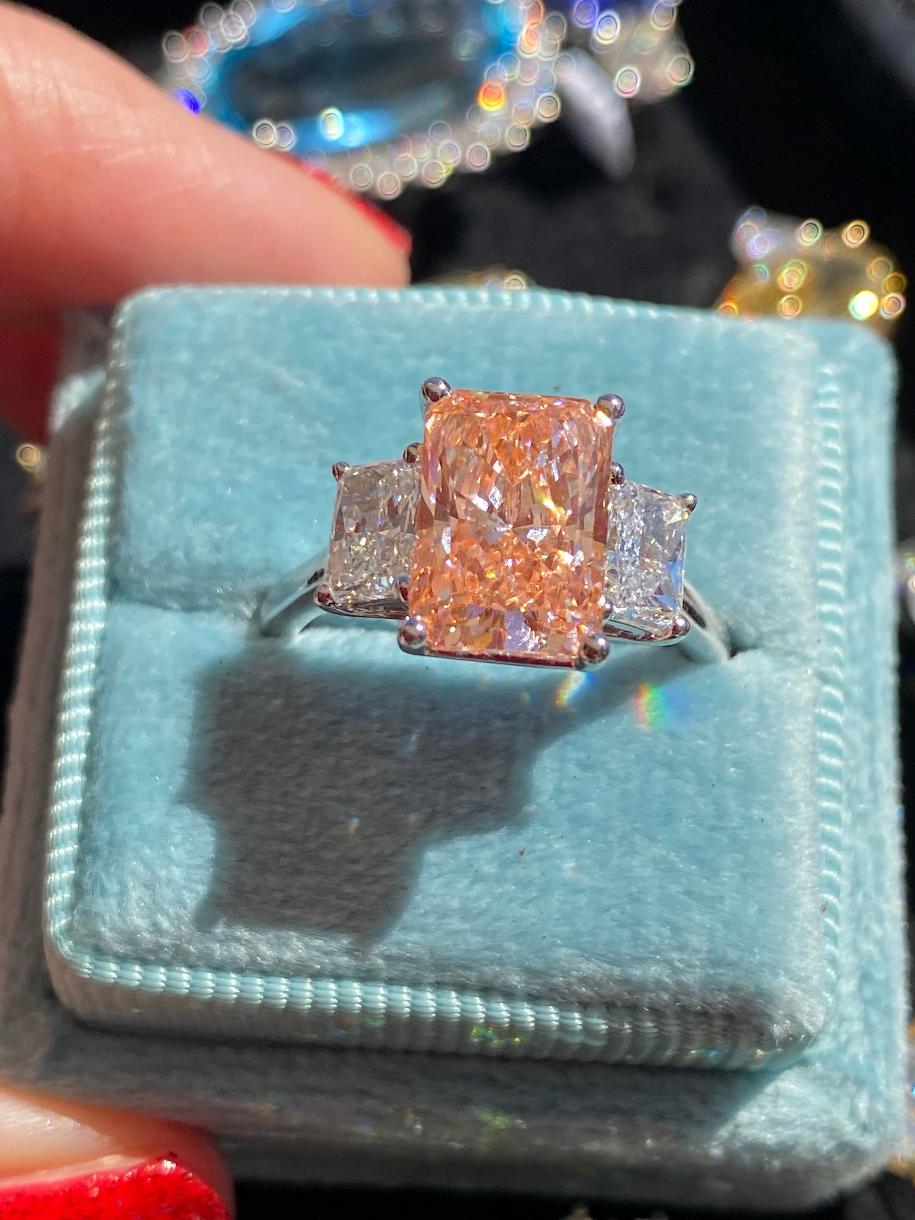 4.12 CTW Fancy Radiant Cut Pink Lab Grown Diamond Graduated Three Stone Ring in Platinum
