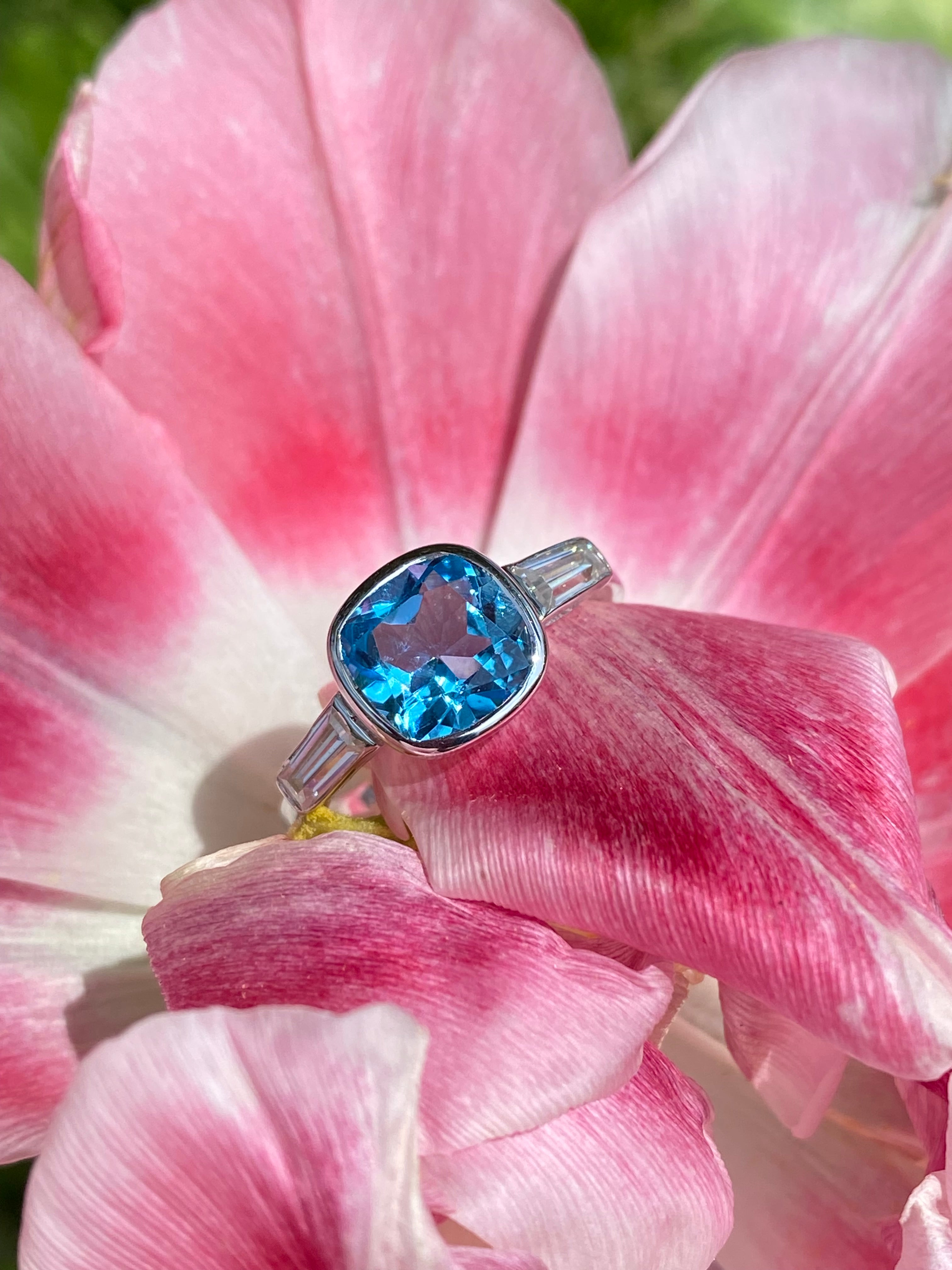 2.33 Carat Cushion Cut Blue Topaz and Moissanite Three Stone Ring in Sterling Silver
