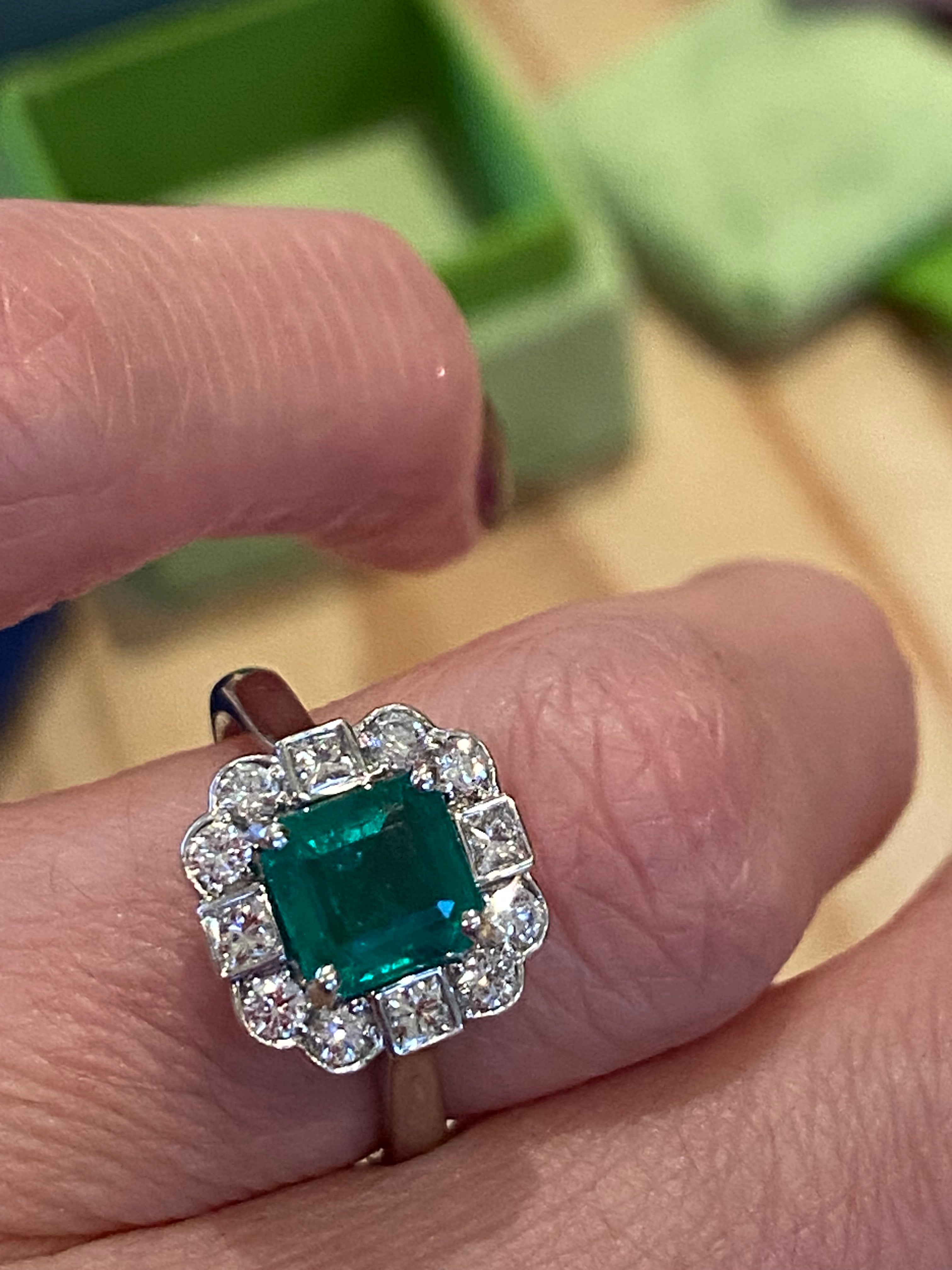 1.35 Carat Emerald Cut Emerald and 0.49 CTW Natural Diamond Halo Ring in Platinum