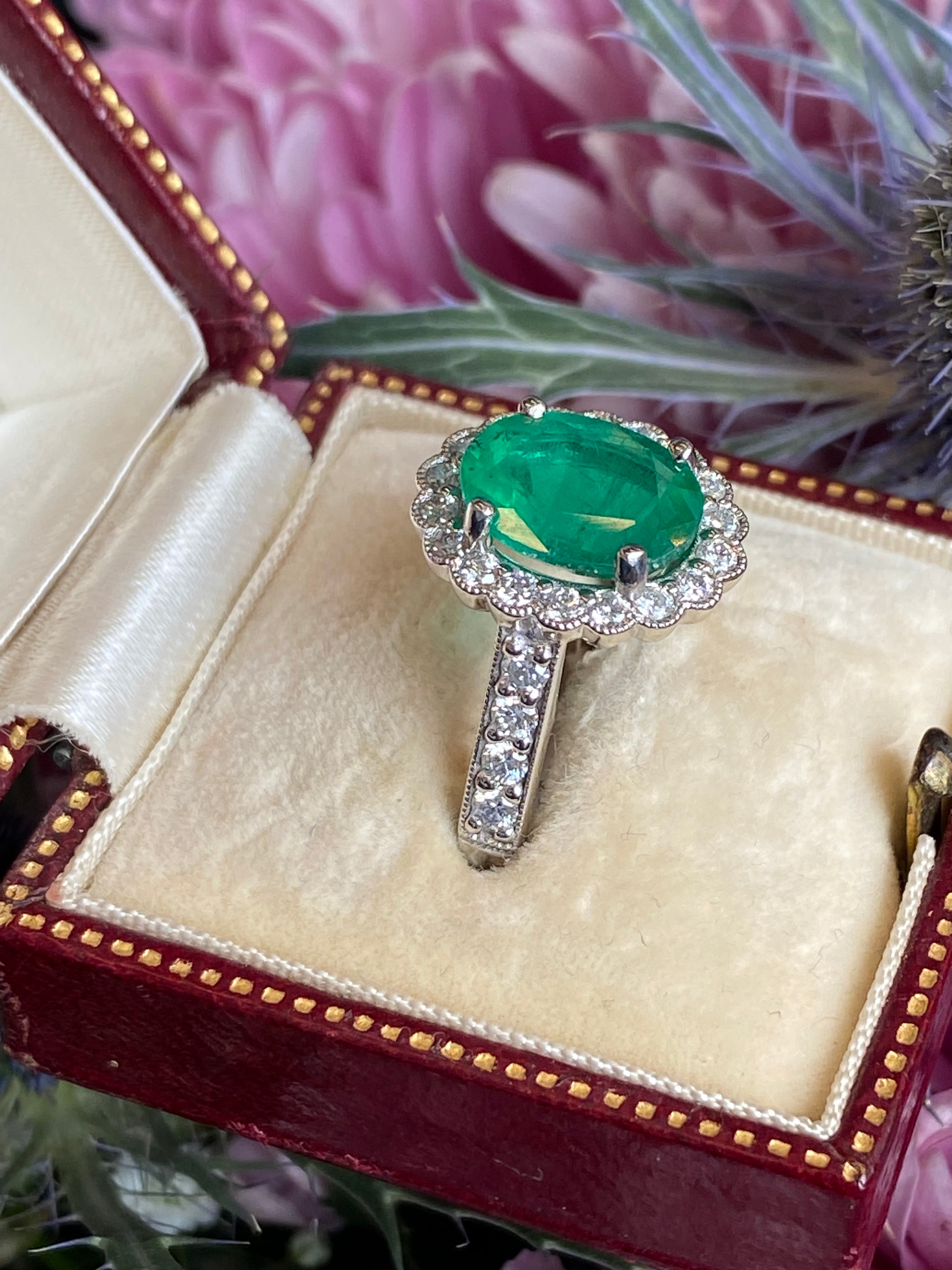 3.12 CTW Oval Cut Emerald and Natural Diamond Halo Ring in Platinum
