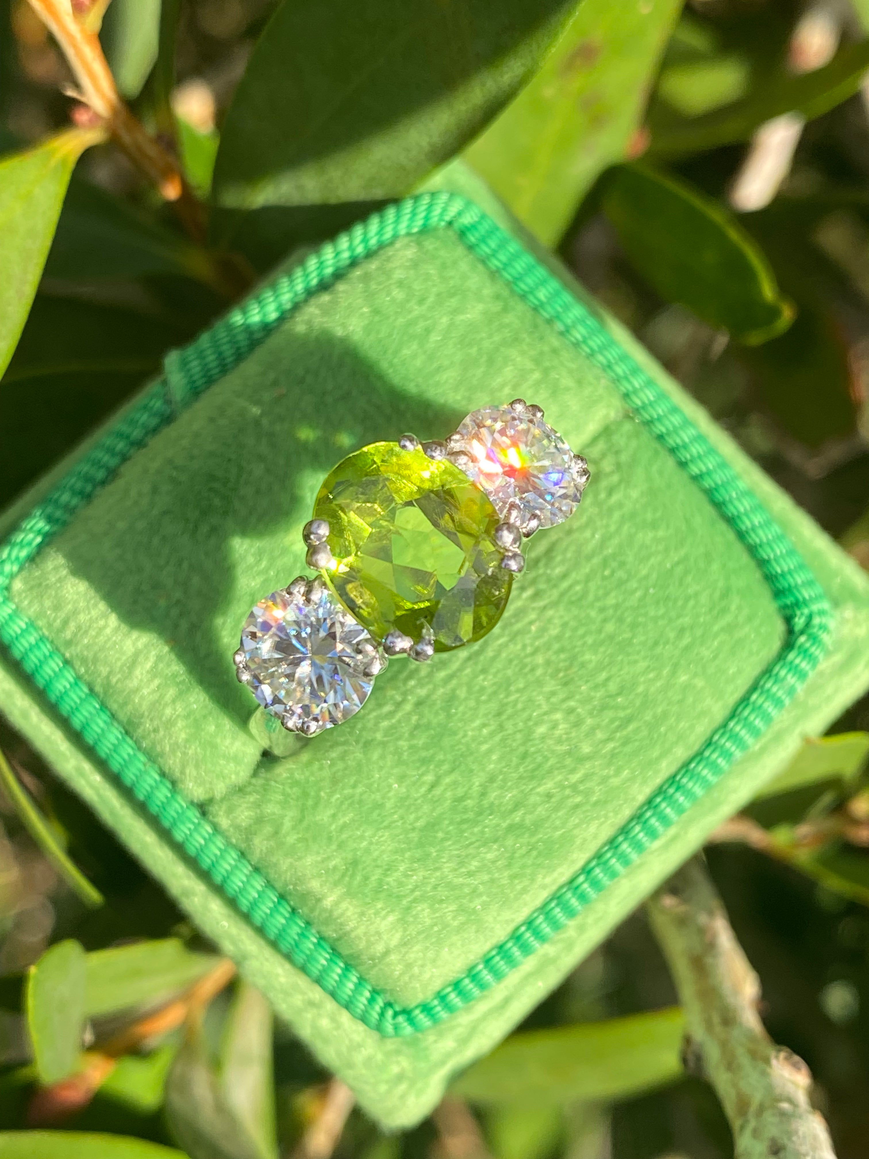 2.57 Carat Peridot and 1.84 Carat Moissanite Three Stone Ring in Sterling Silver