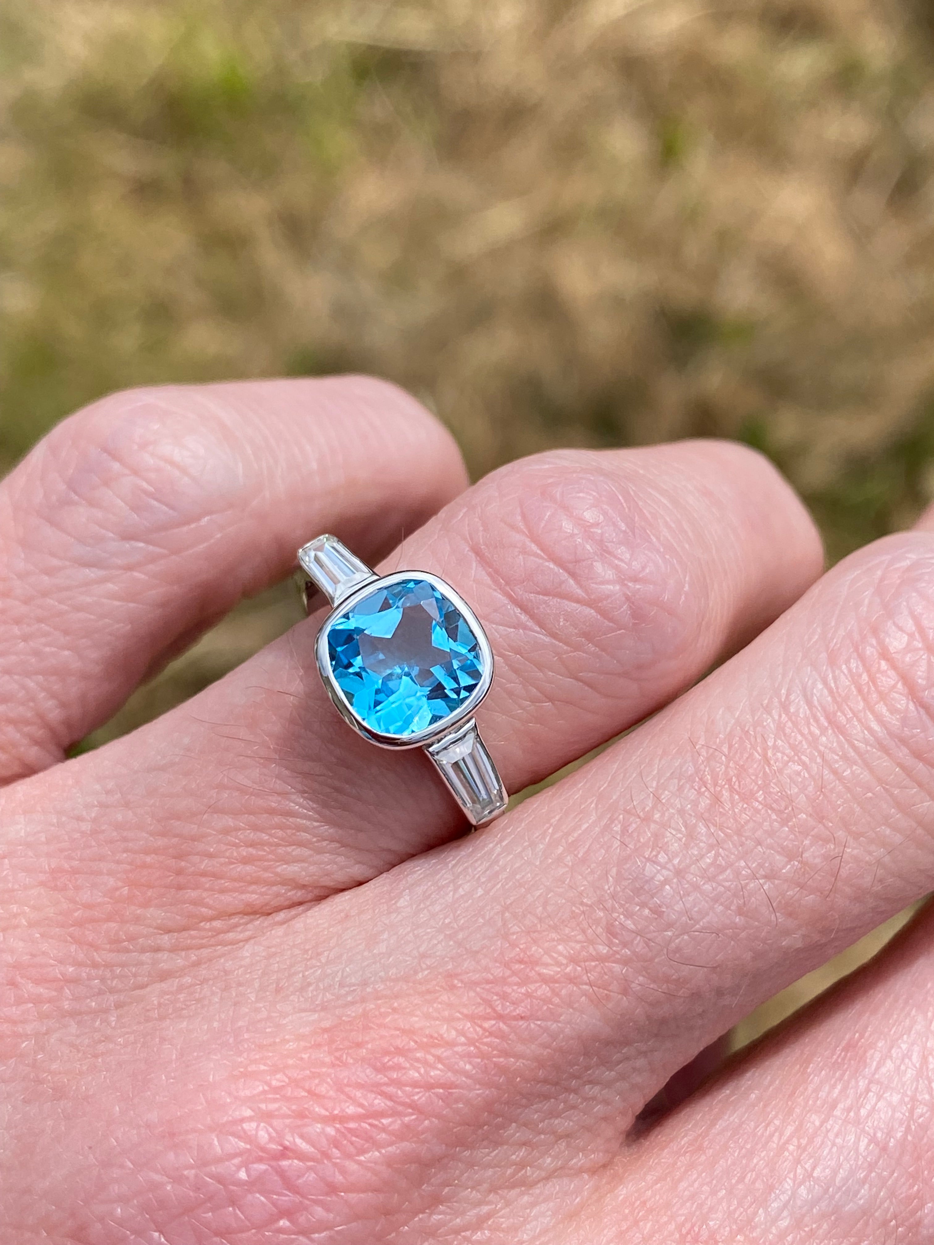 2.33 Carat Cushion Cut Blue Topaz and Moissanite Three Stone Ring in Sterling Silver