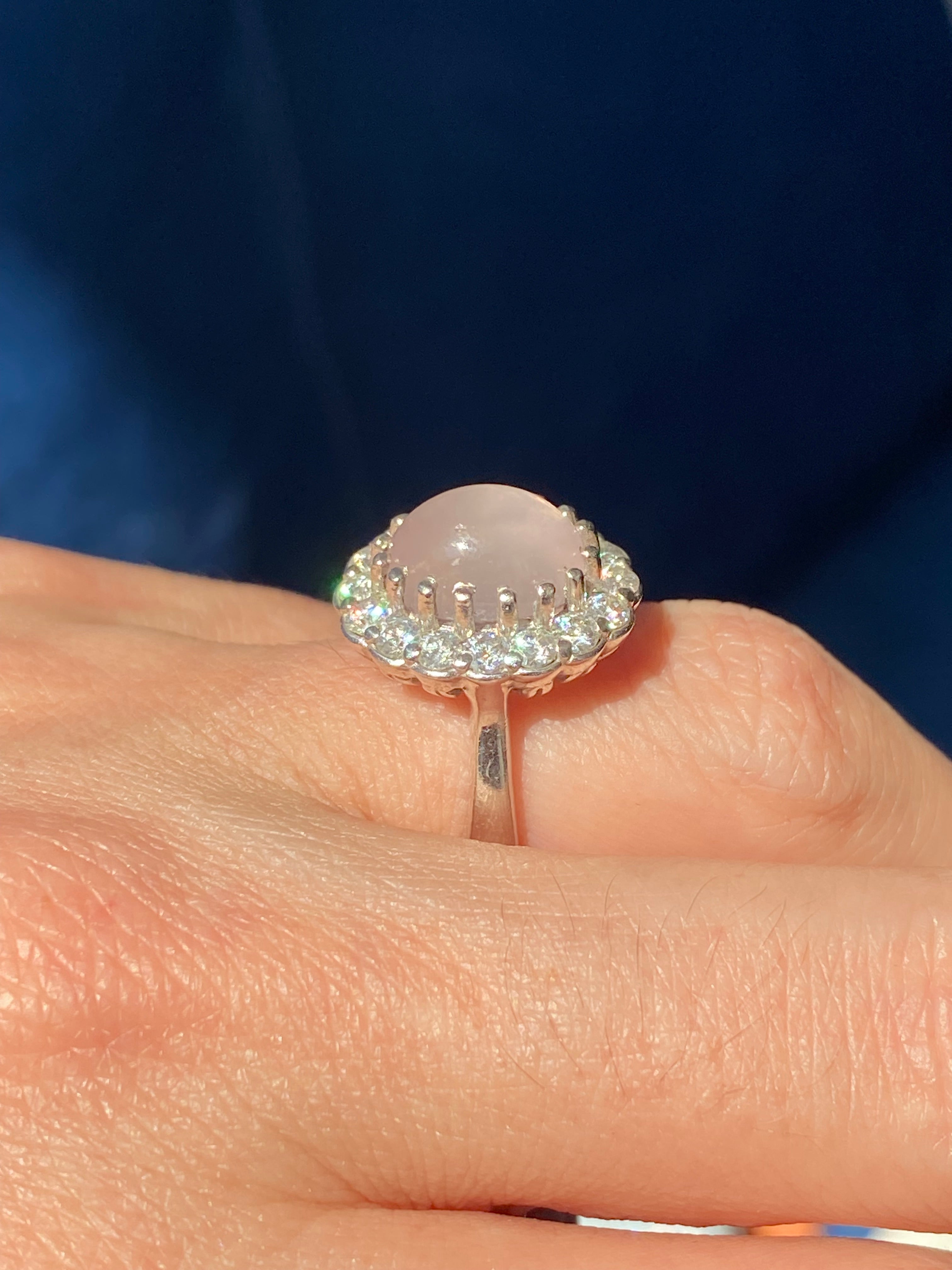 4.50 CTW Oval Cabochon Cut Rose Quartz and Moissanite Halo Cocktail Ring in Sterling Silver