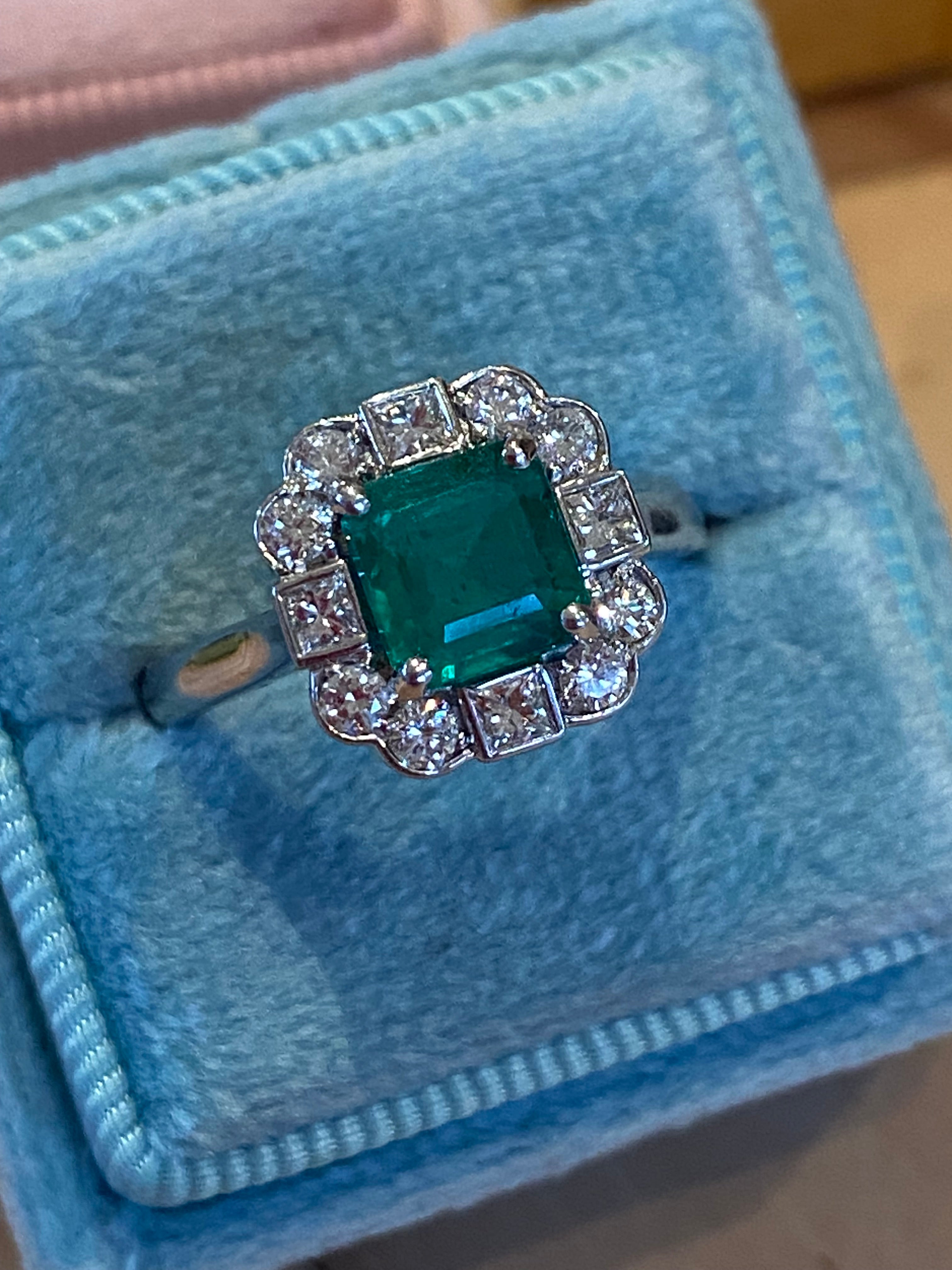 1.35 Carat Emerald Cut Emerald and 0.49 CTW Natural Diamond Halo Ring in Platinum