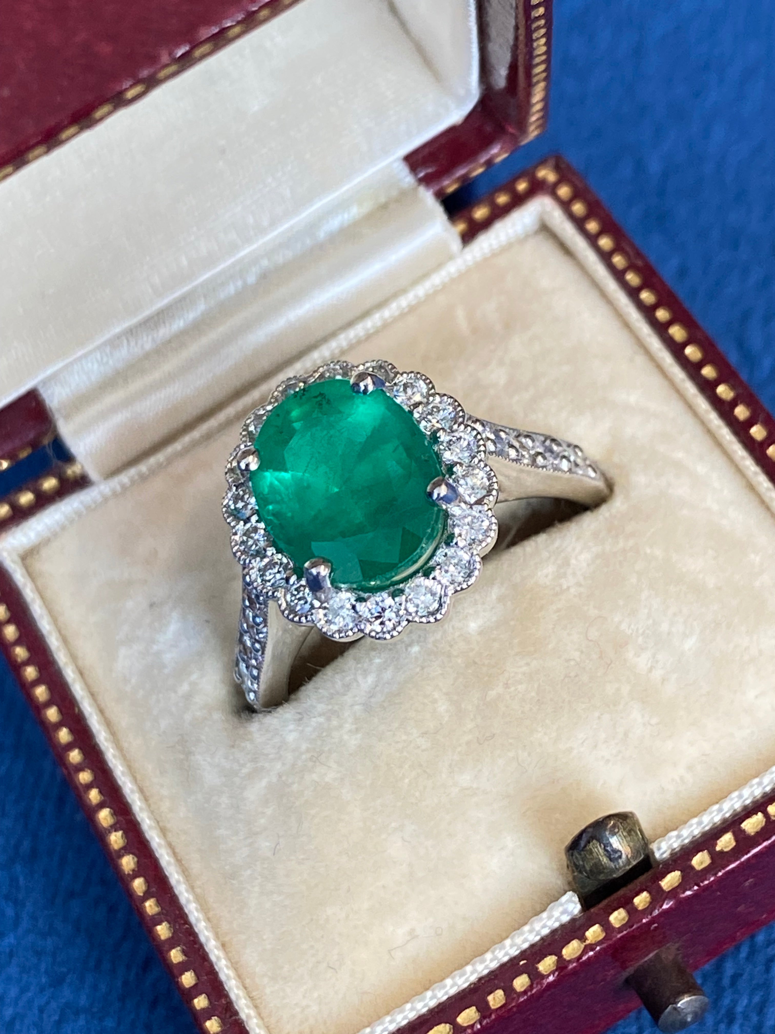 3.12 CTW Oval Cut Emerald and Natural Diamond Halo Ring in Platinum