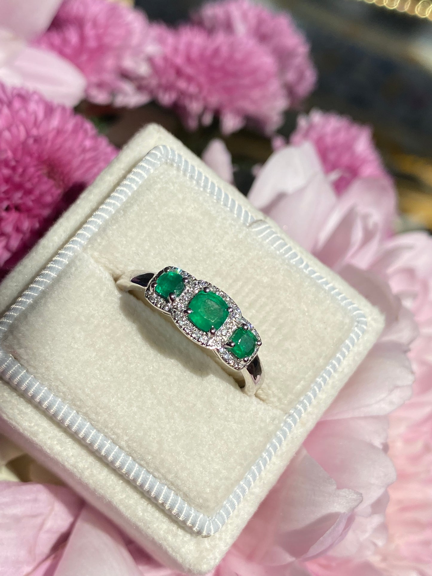 0.65ctw Emerald and Diamond Three Stone Halo Ring in Platinum