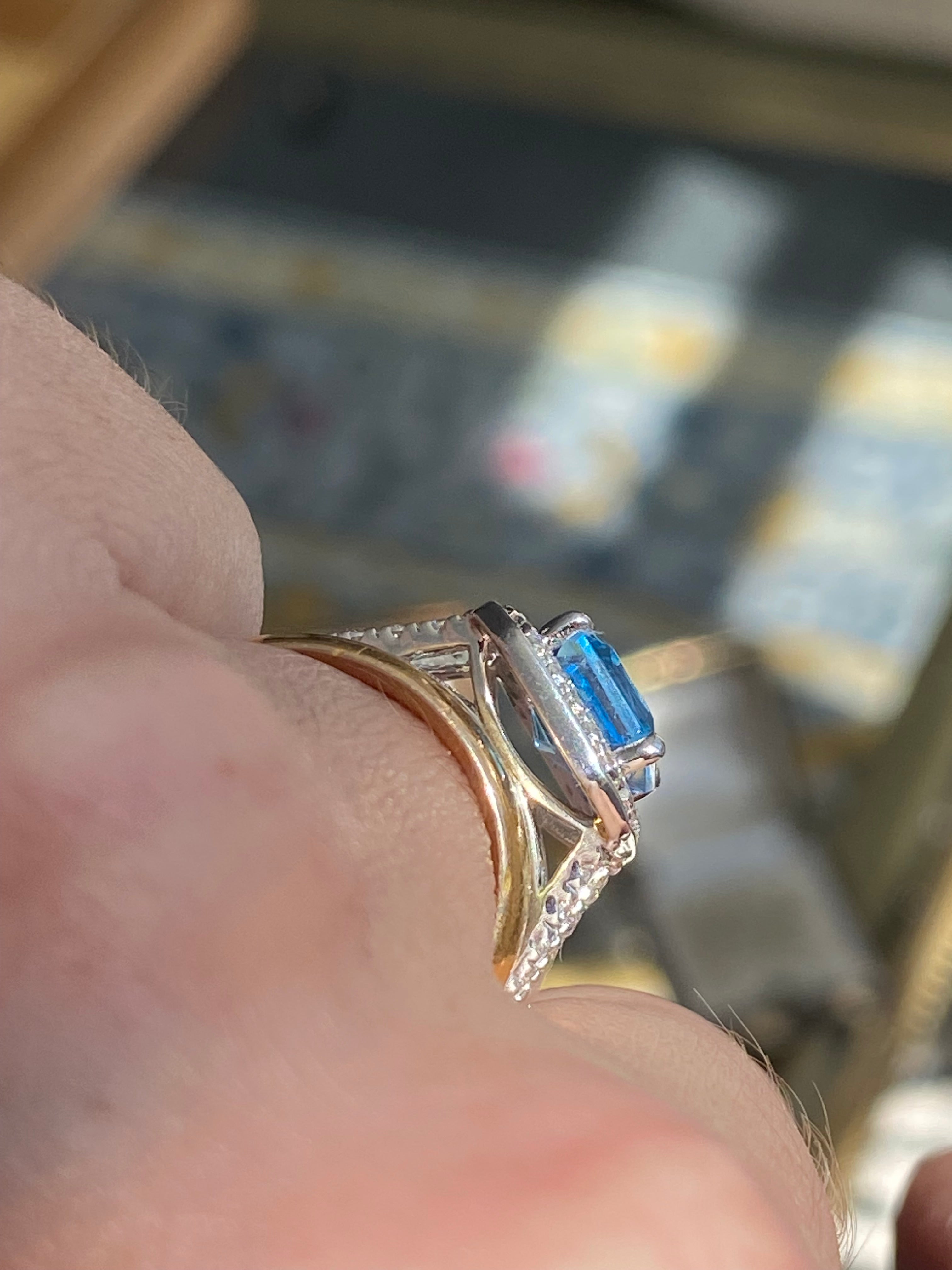 3.10 CTW Emerald Cut Moissanite and Blue Topaz Halo Ring in Sterling Silver