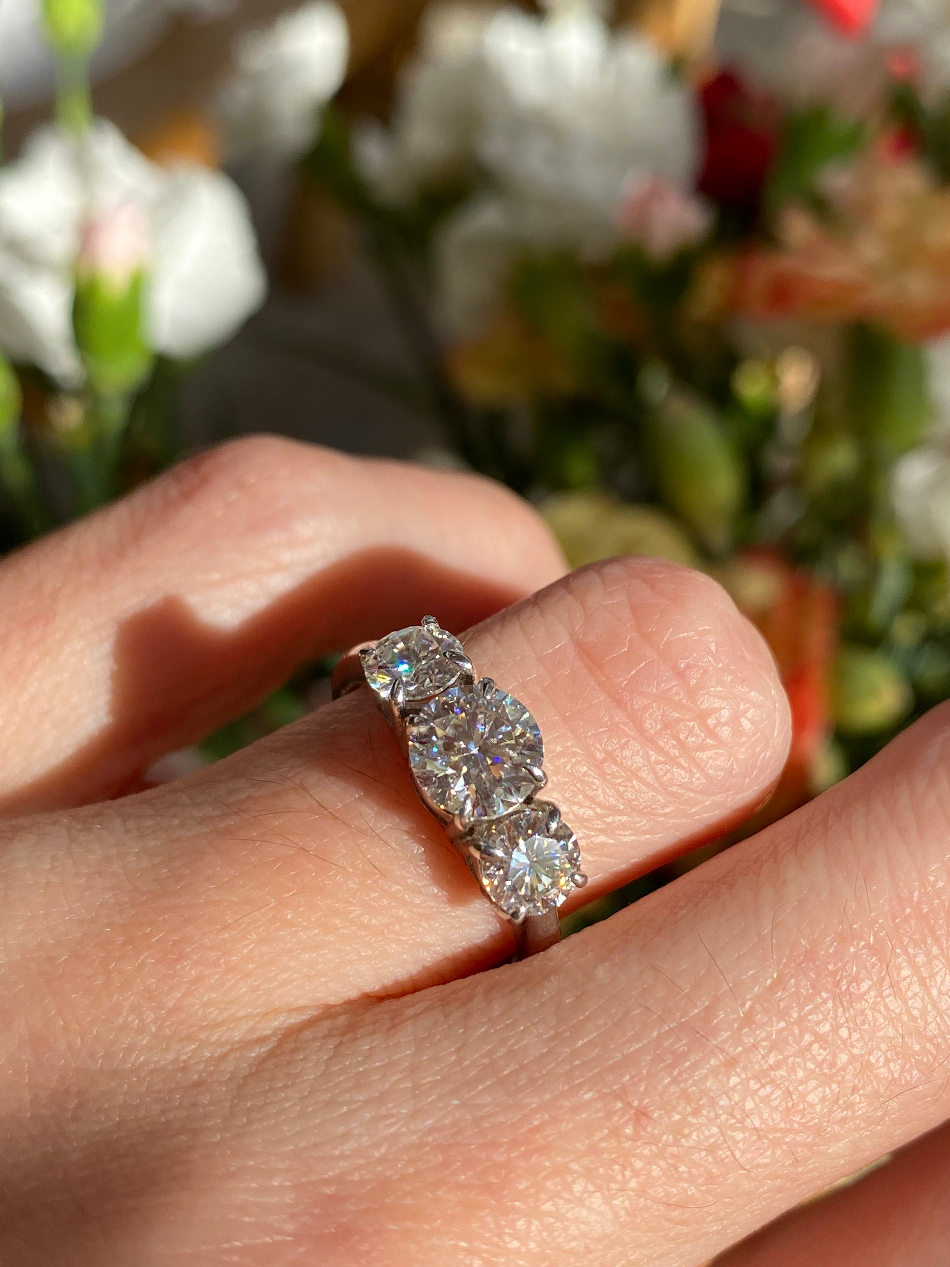 1.78 CTW Round Cut Moissanite Three Stone Ring in Sterling Silver