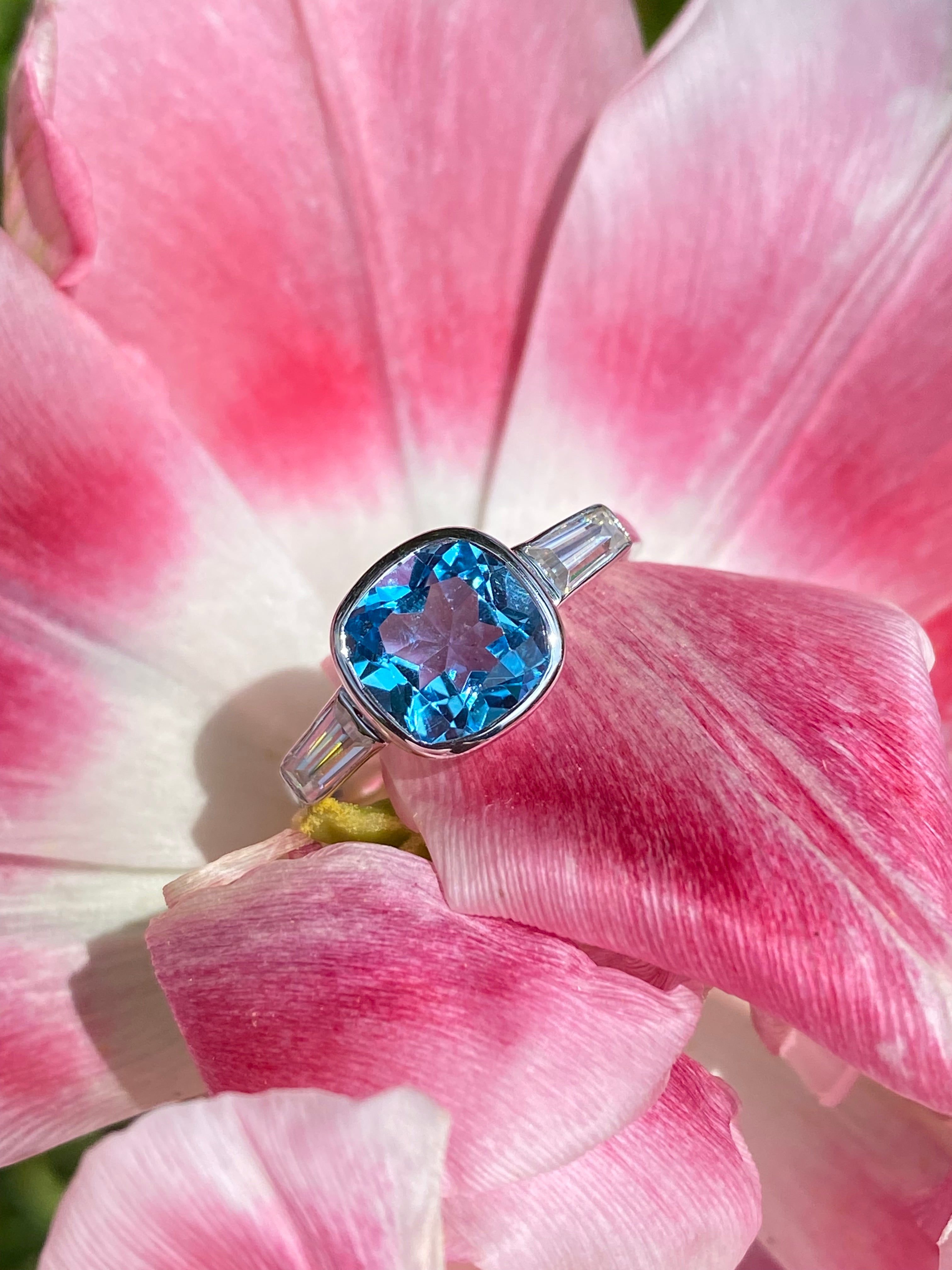2.33 Carat Cushion Cut Blue Topaz and Moissanite Three Stone Ring in Sterling Silver