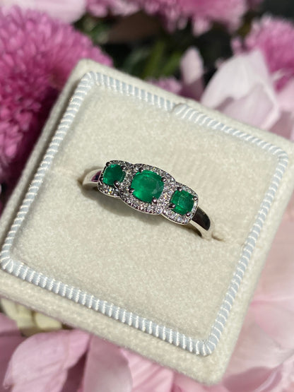 0.65ctw Emerald and Diamond Three Stone Halo Ring in Platinum