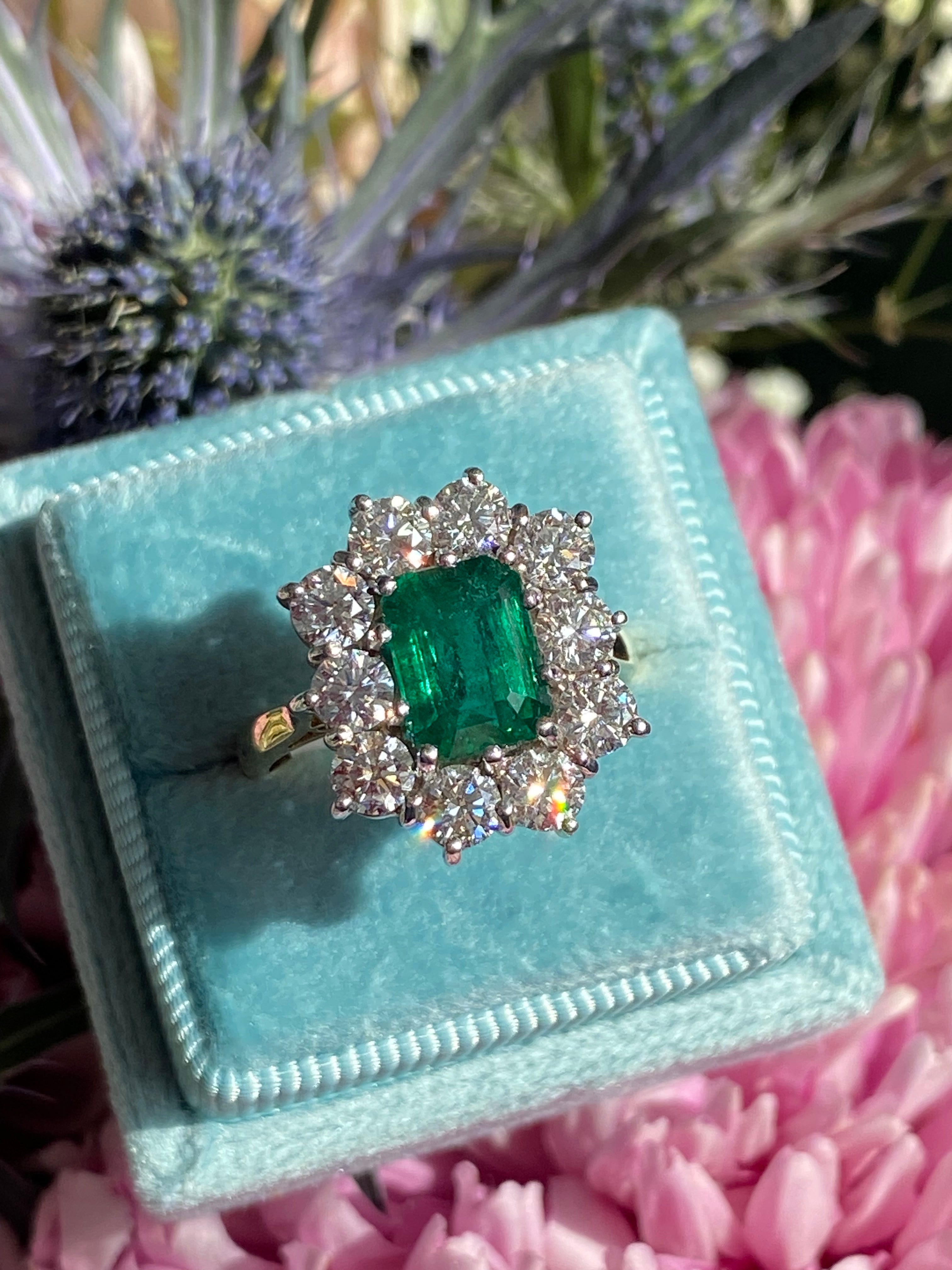 Outrageously Fantastic 4.17 CTW Emerald and Diamond Halo Ring in 18ct White and Yellow Gold