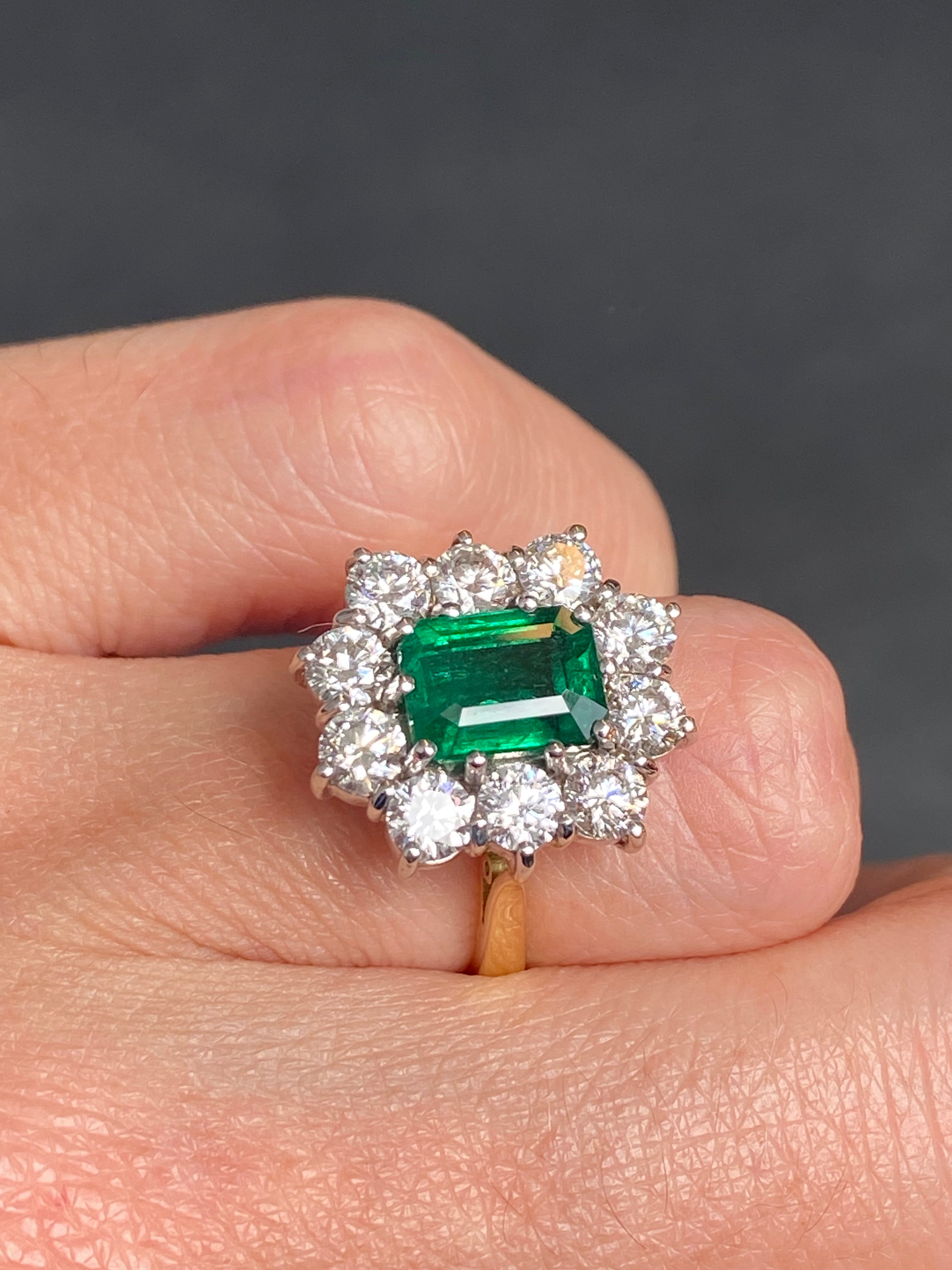 Outrageously Fantastic 4.17 CTW Emerald and Diamond Halo Ring in 18ct White and Yellow Gold