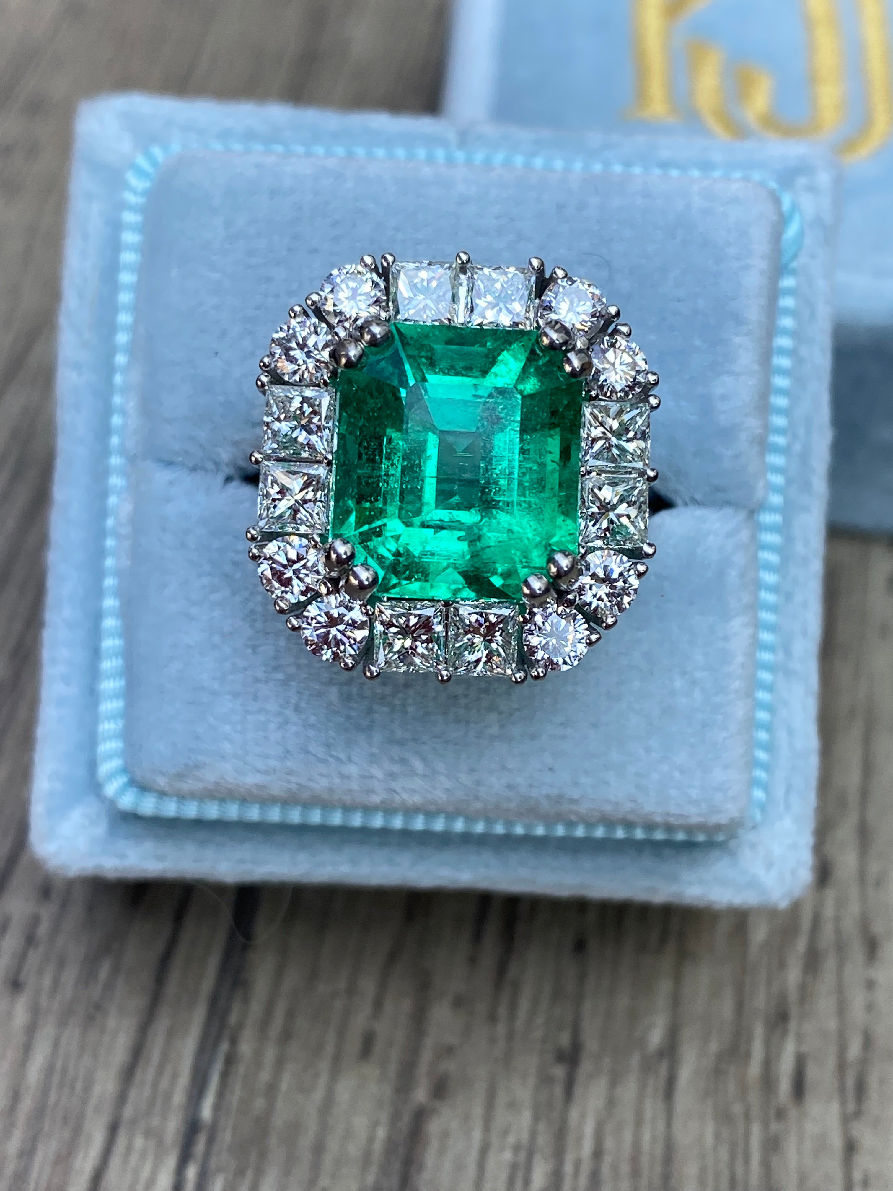 5.92 Carat Emerald Cut Colombian Emerald and Diamond Halo Ring in Platinum