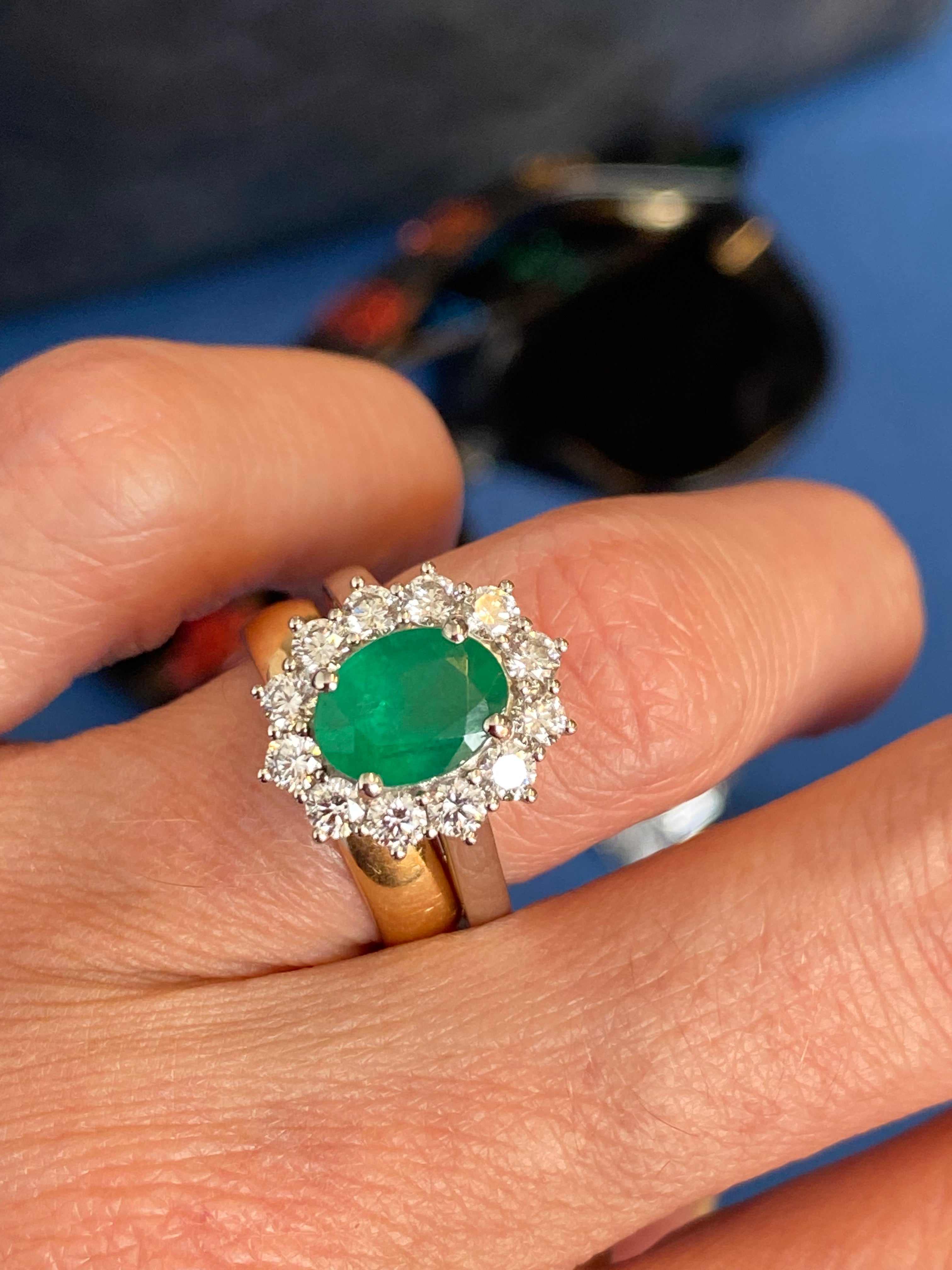 1.53 Carat Cushion Cut Emerald and 0.96 CTW Natural Diamond Halo Ring in Platinum