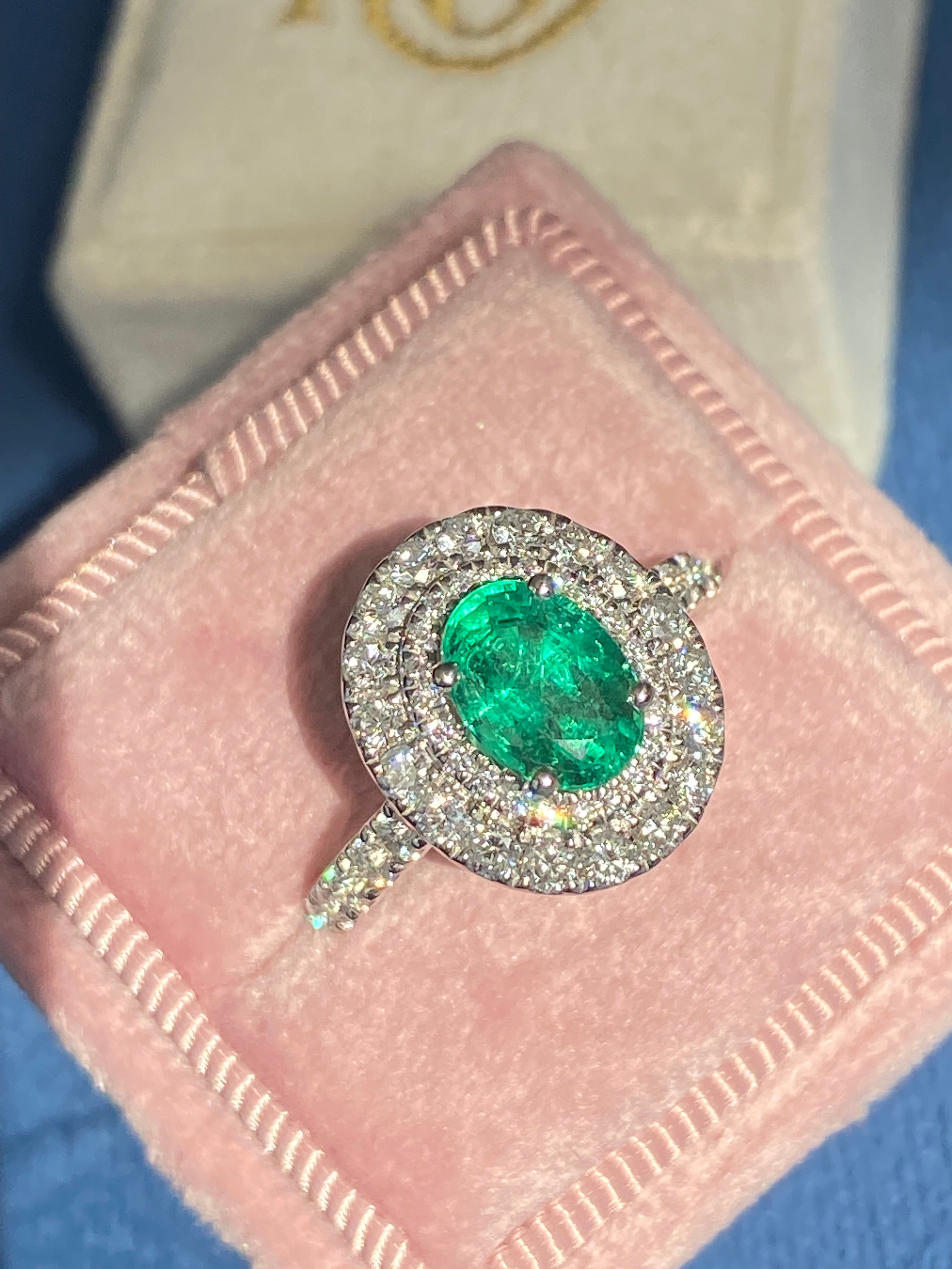 2.11 CTW Oval Cut Emerald and Natural Diamond Double Halo Ring in Platinum