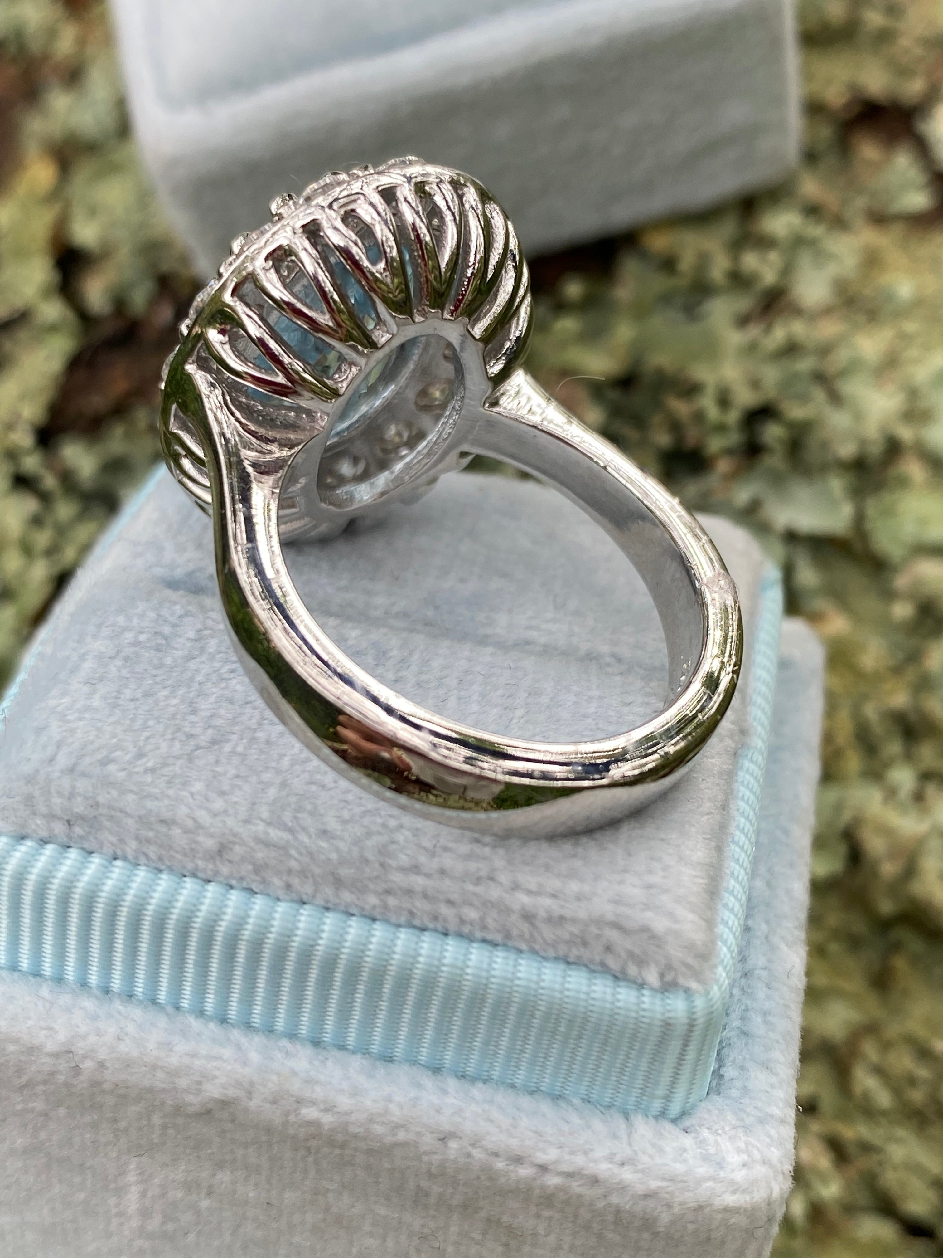 9.60 CTW Oval Cut Blue Topaz and Moissanite Halo Cocktail Ring in Sterling Silver