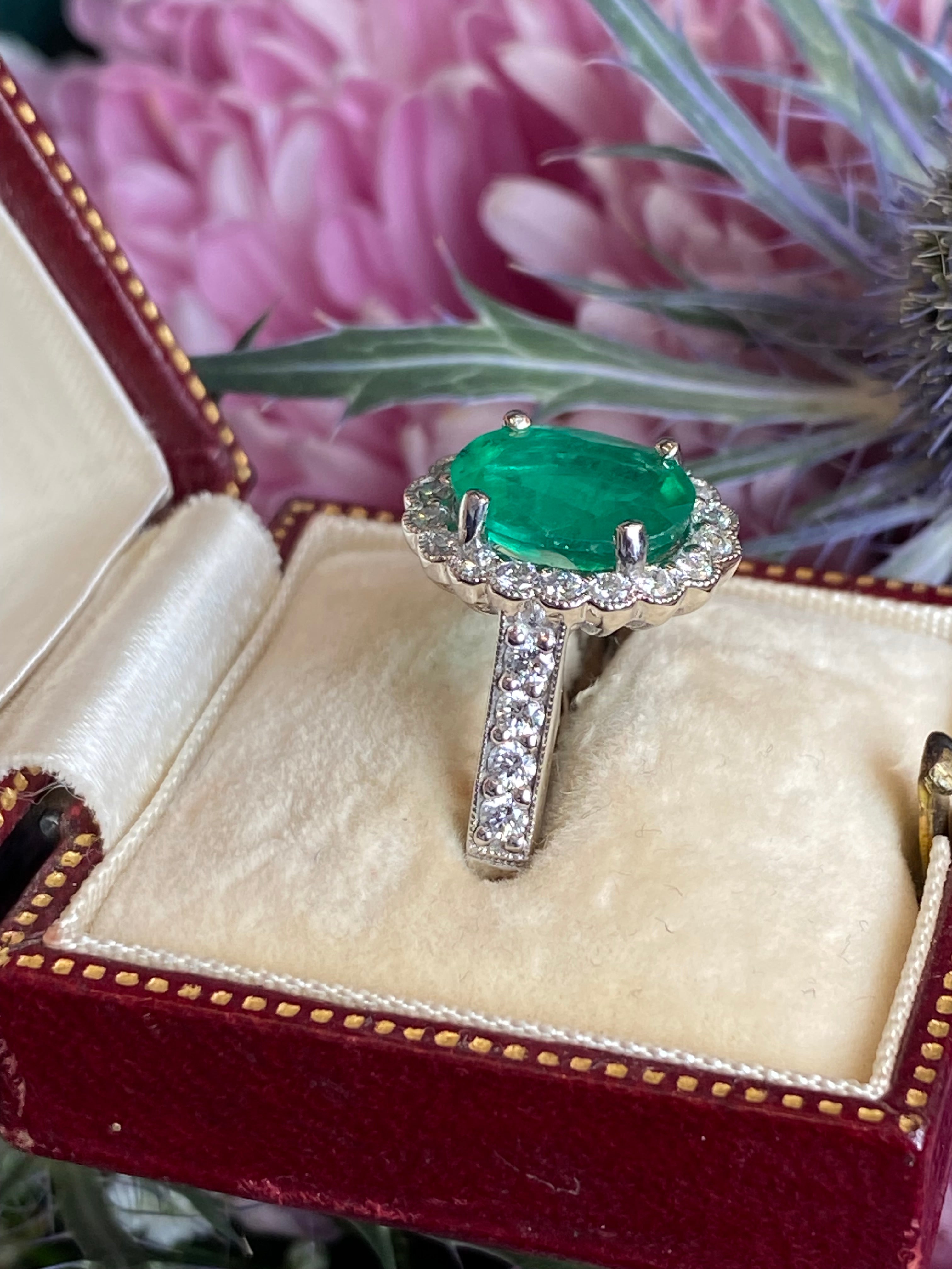 3.12 CTW Oval Cut Emerald and Natural Diamond Halo Ring in Platinum