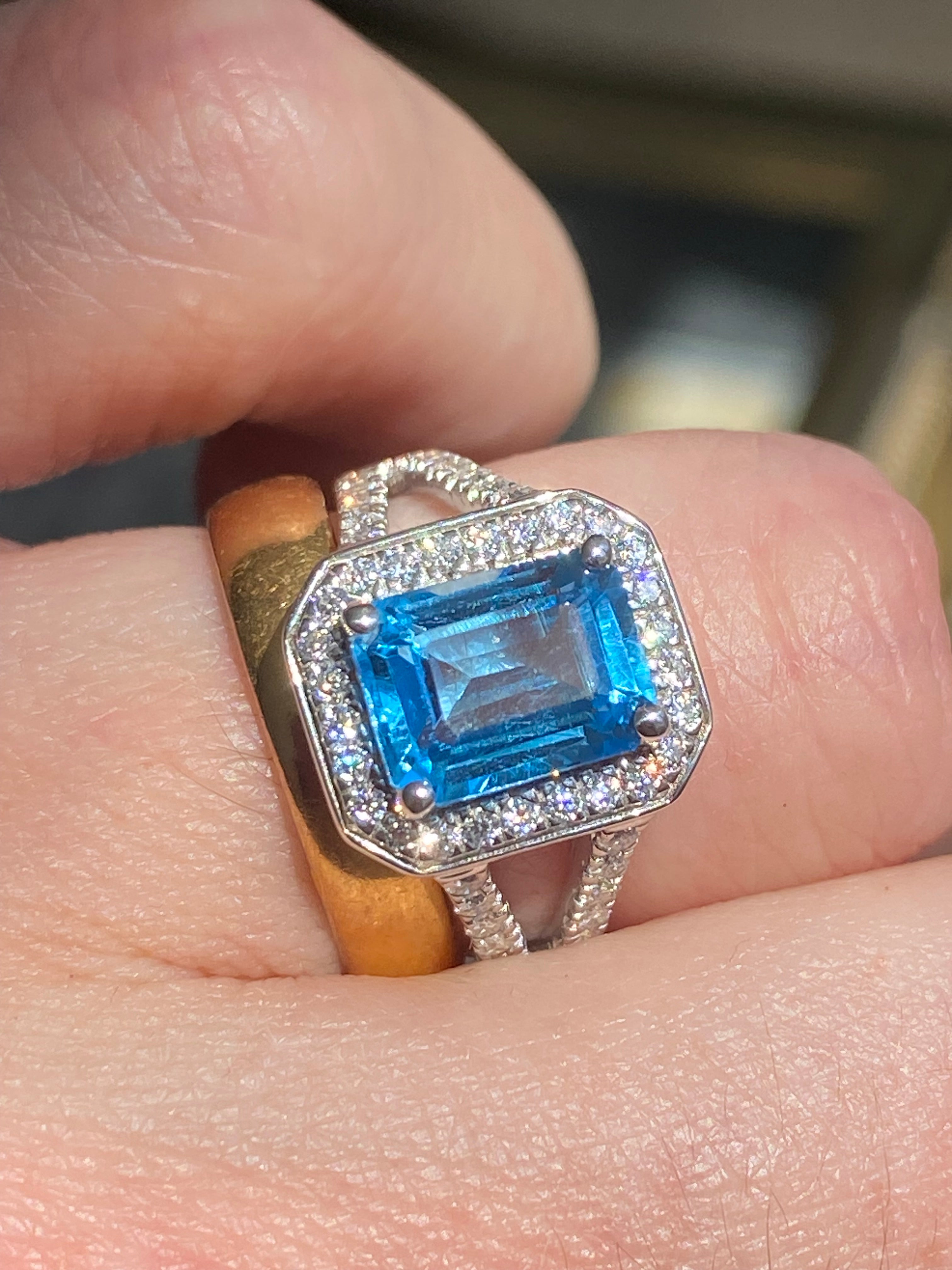 3.10 CTW Emerald Cut Moissanite and Blue Topaz Halo Ring in Sterling Silver