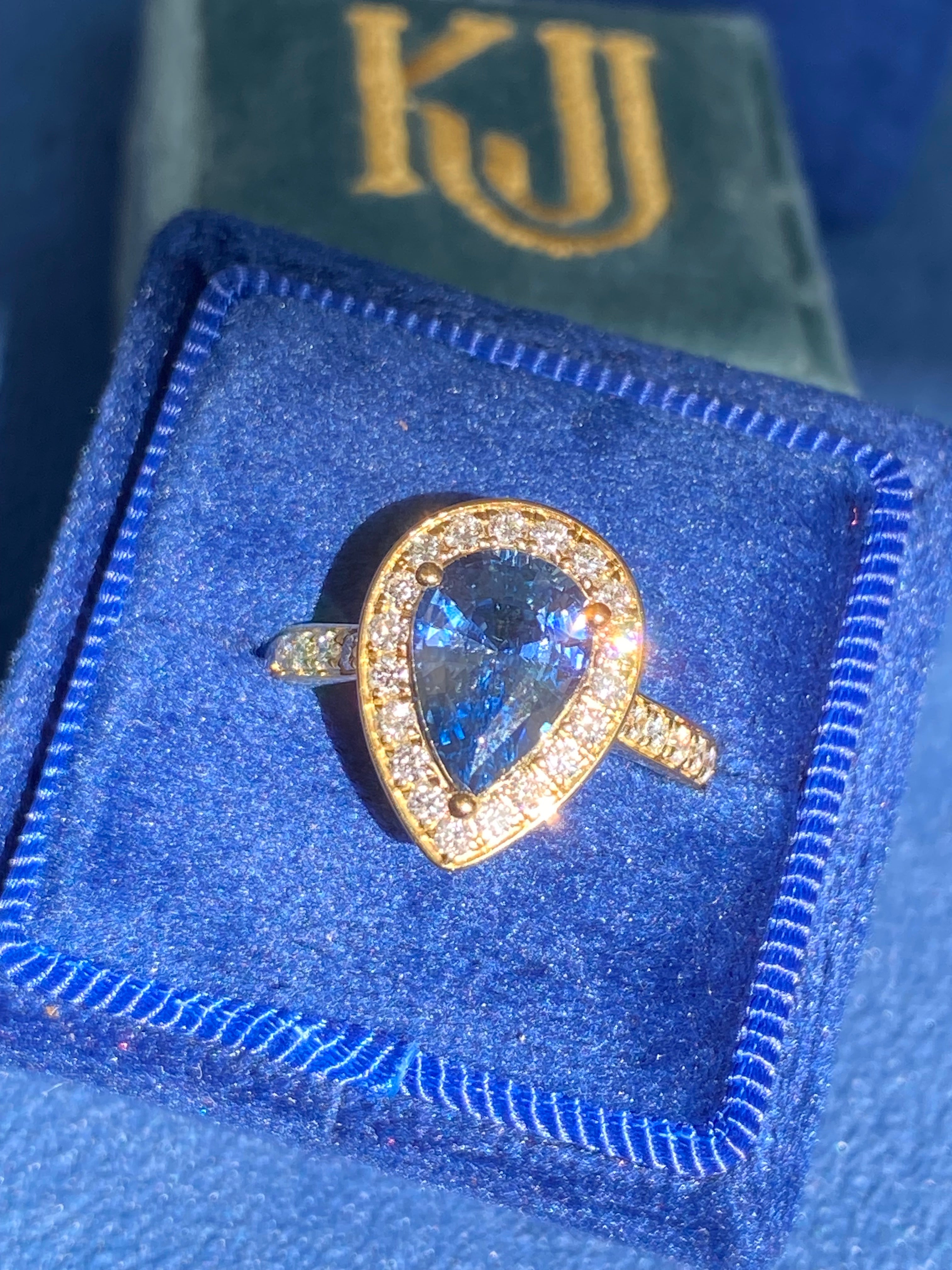 2.07 Carat Pear Cut Teal Sapphire and 0.48 CTW Natural Diamond Ring in 18ct Yellow Gold
