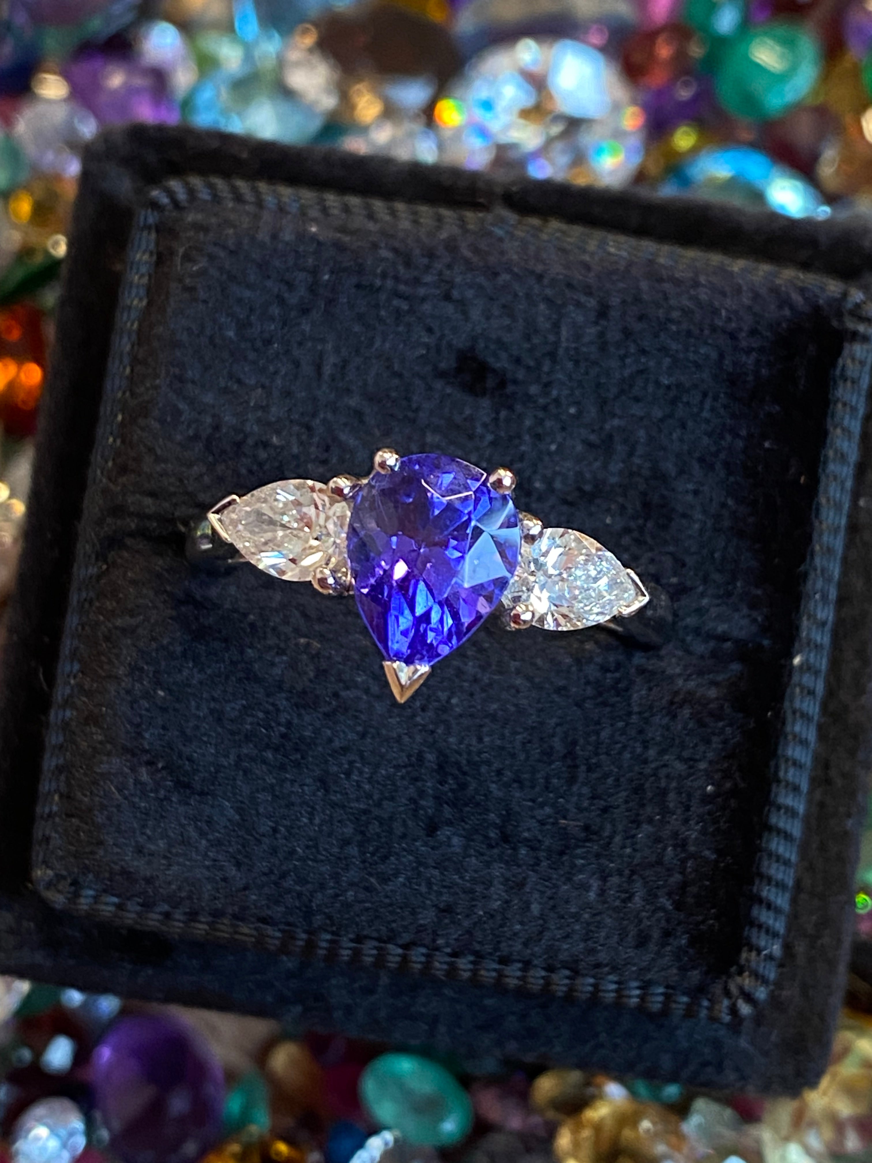 2.47 CTW Pear Cut Tanzanite and Natural Diamond Three Stone Ring in Platinum