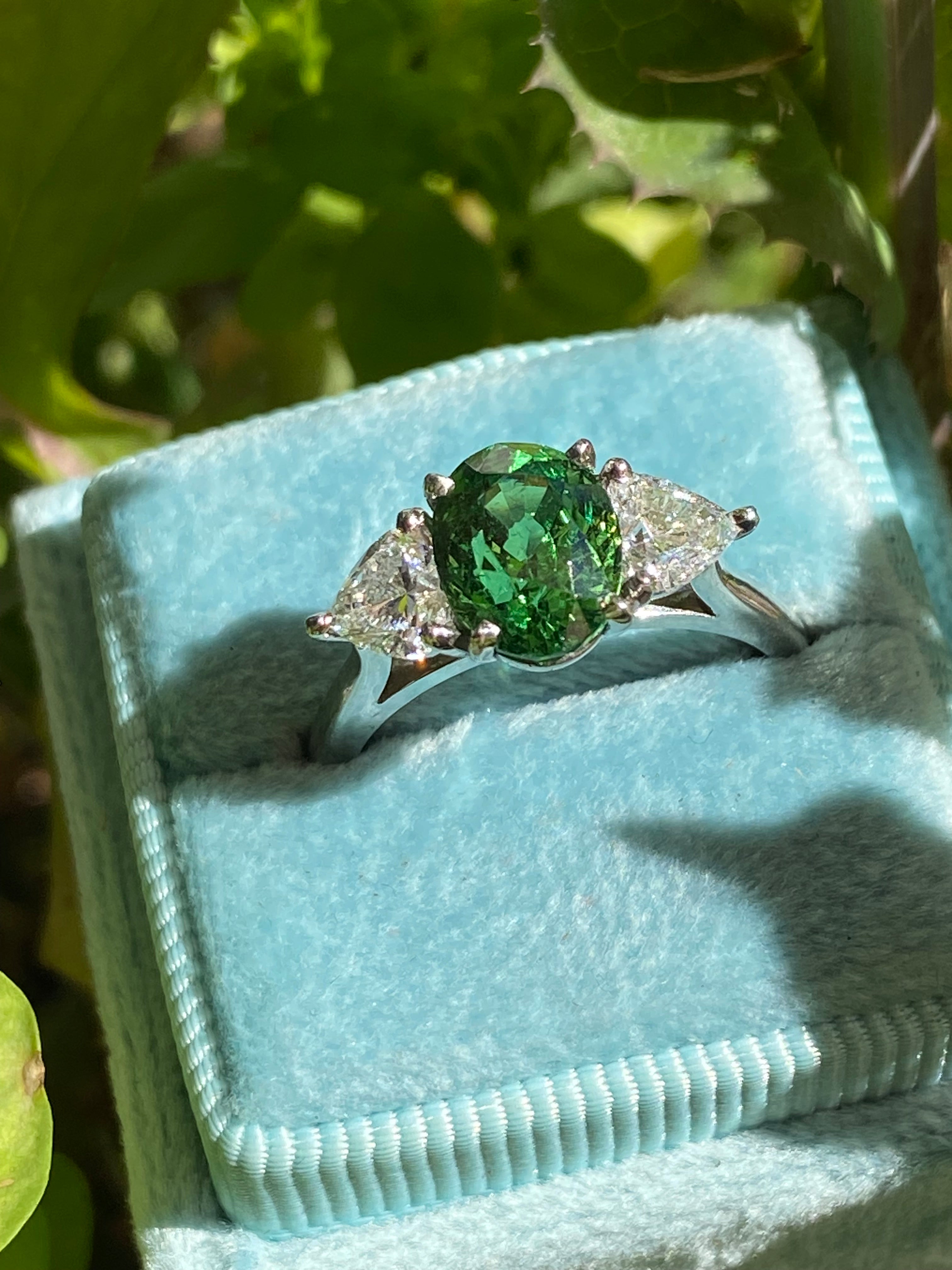 2.49 Carat Tsavorite Garnet and 0.83 Carat Diamond Three Stone Engagement Ring in Platinum