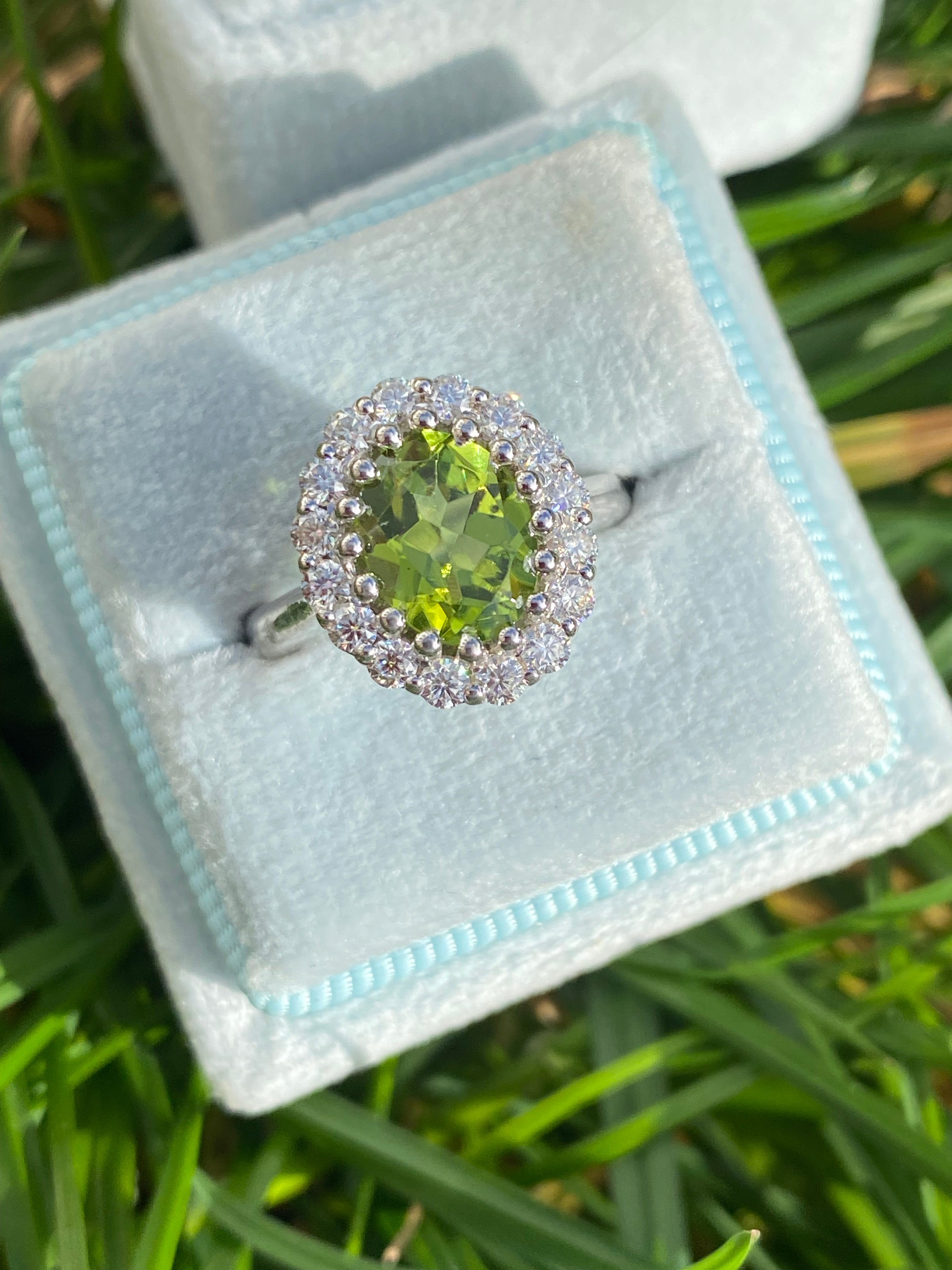 2.33 CTW Oval Cut Peridot and Moissanite Halo Cocktail Ring in Sterling Silver