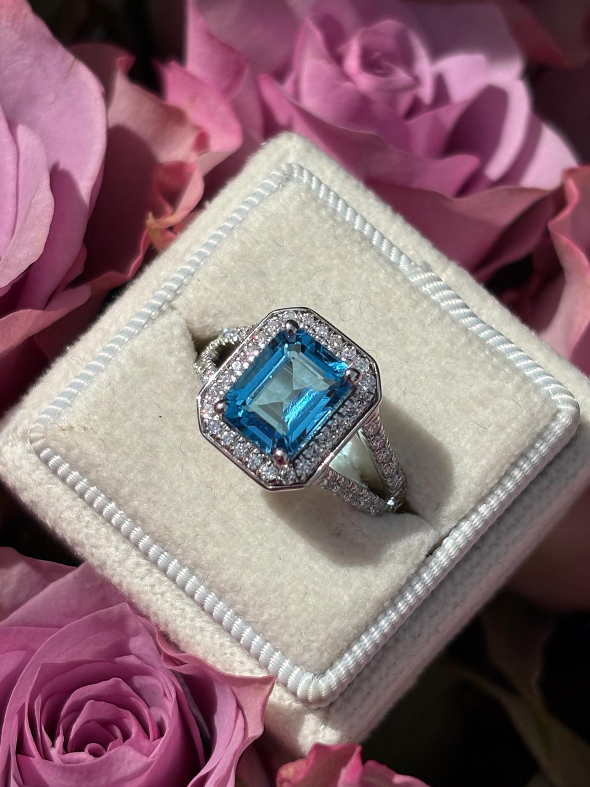 3.10 CTW Emerald Cut Moissanite and Blue Topaz Halo Ring in Sterling Silver