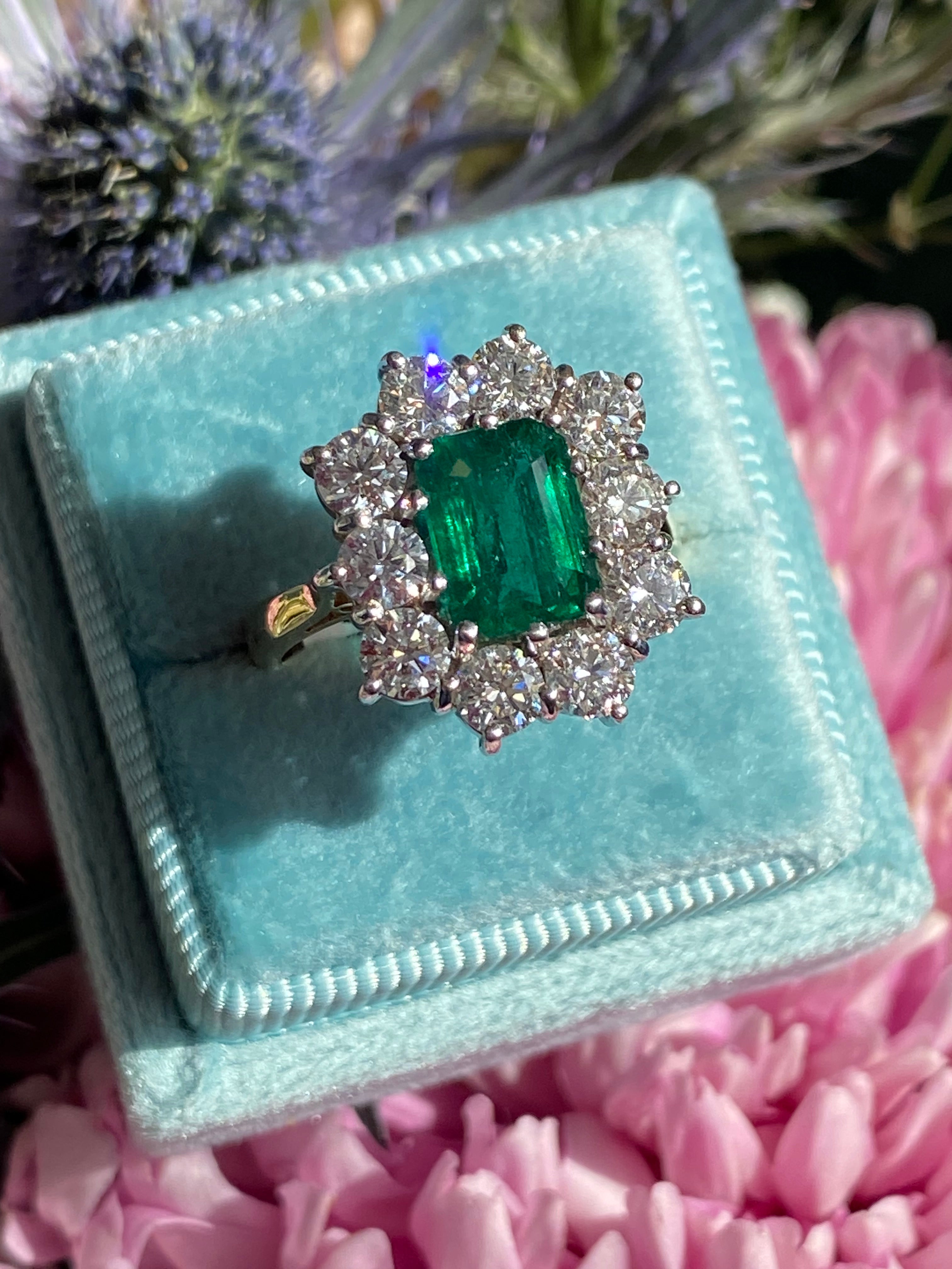 Outrageously Fantastic 4.17 CTW Emerald and Diamond Halo Ring in 18ct White and Yellow Gold