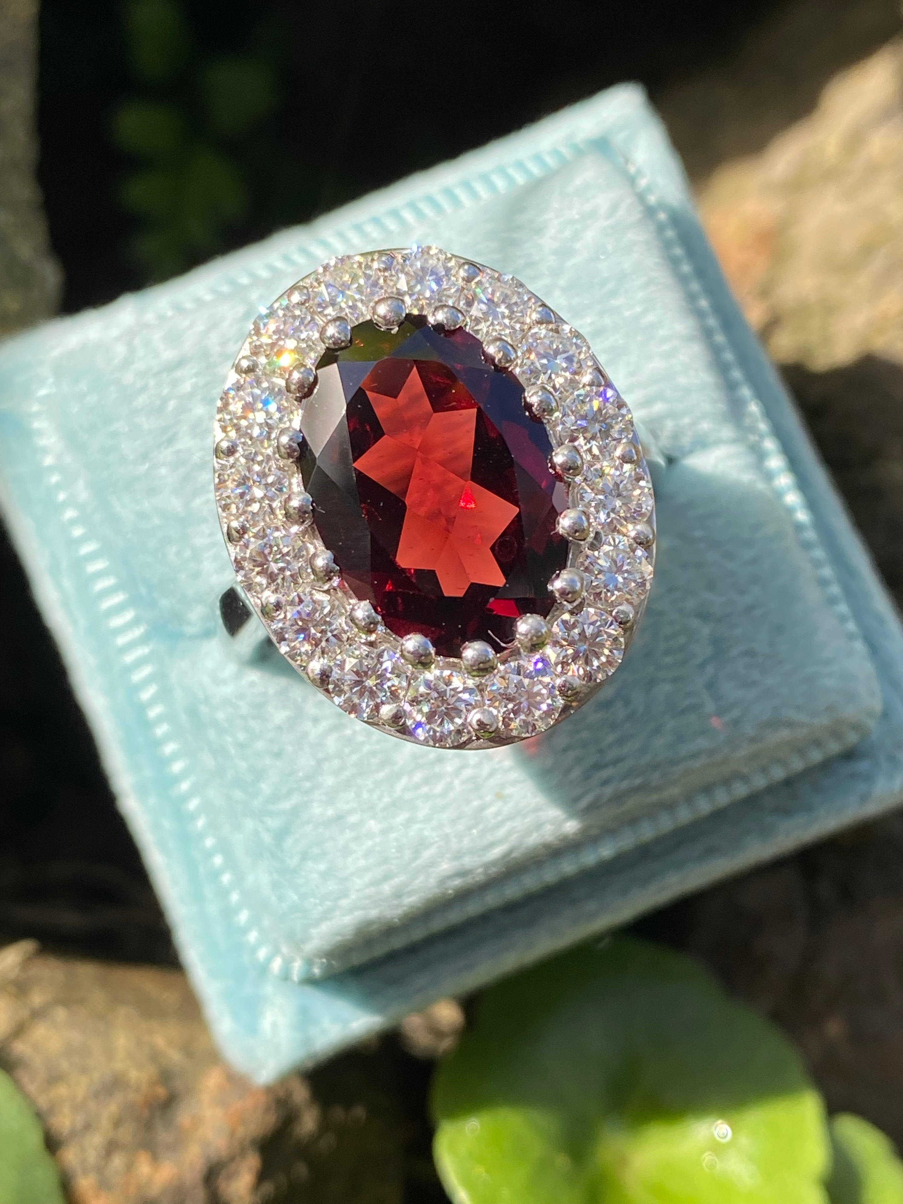 8.25 CTW Oval Cut Garnet and Moissanite Halo Cocktail Ring in Sterling Silver