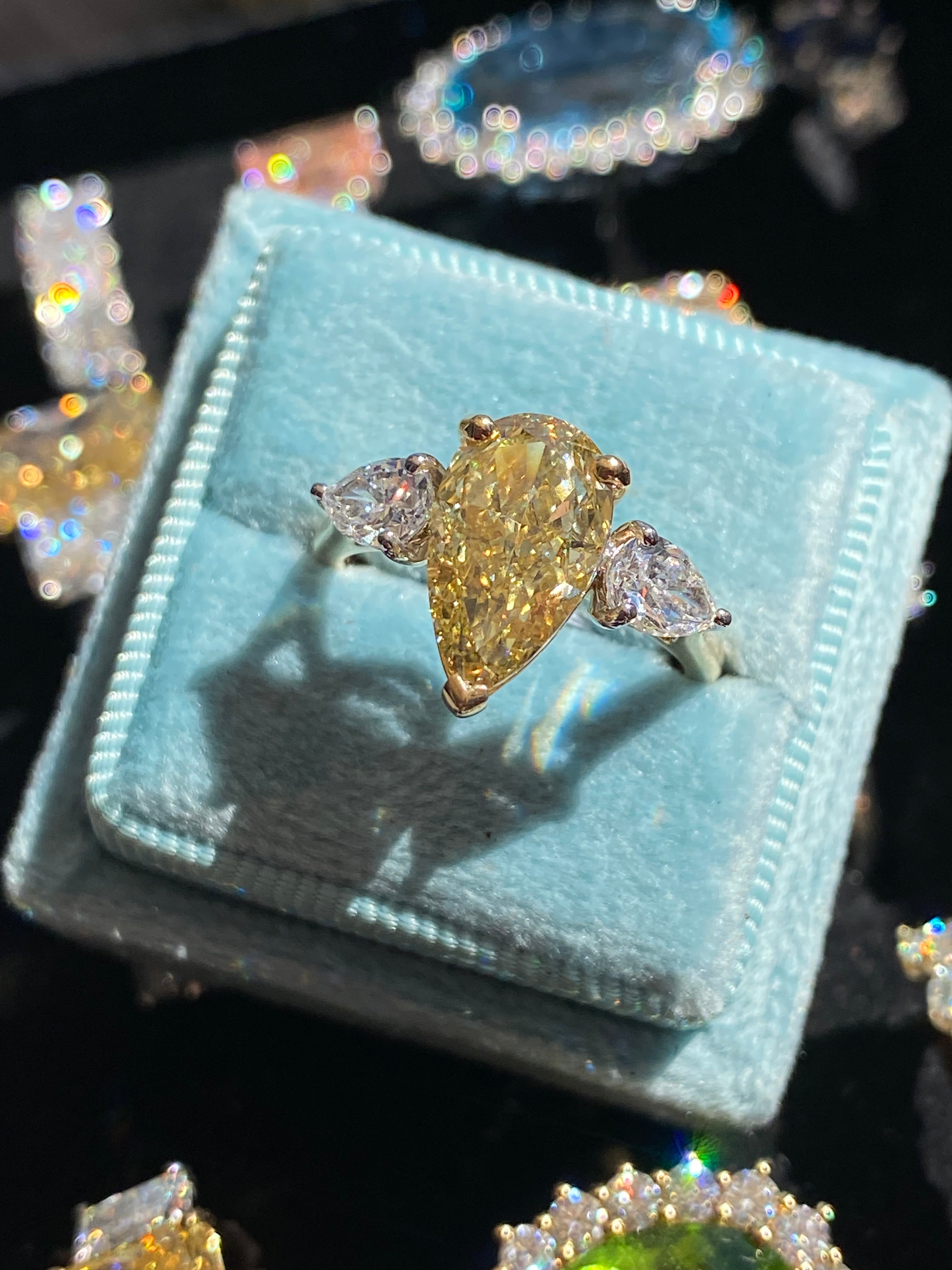 4.04 CTW Pear Cut Fancy Yellow Lab Diamond Three Stone Engagement Ring in 18ct Yellow and White Gold