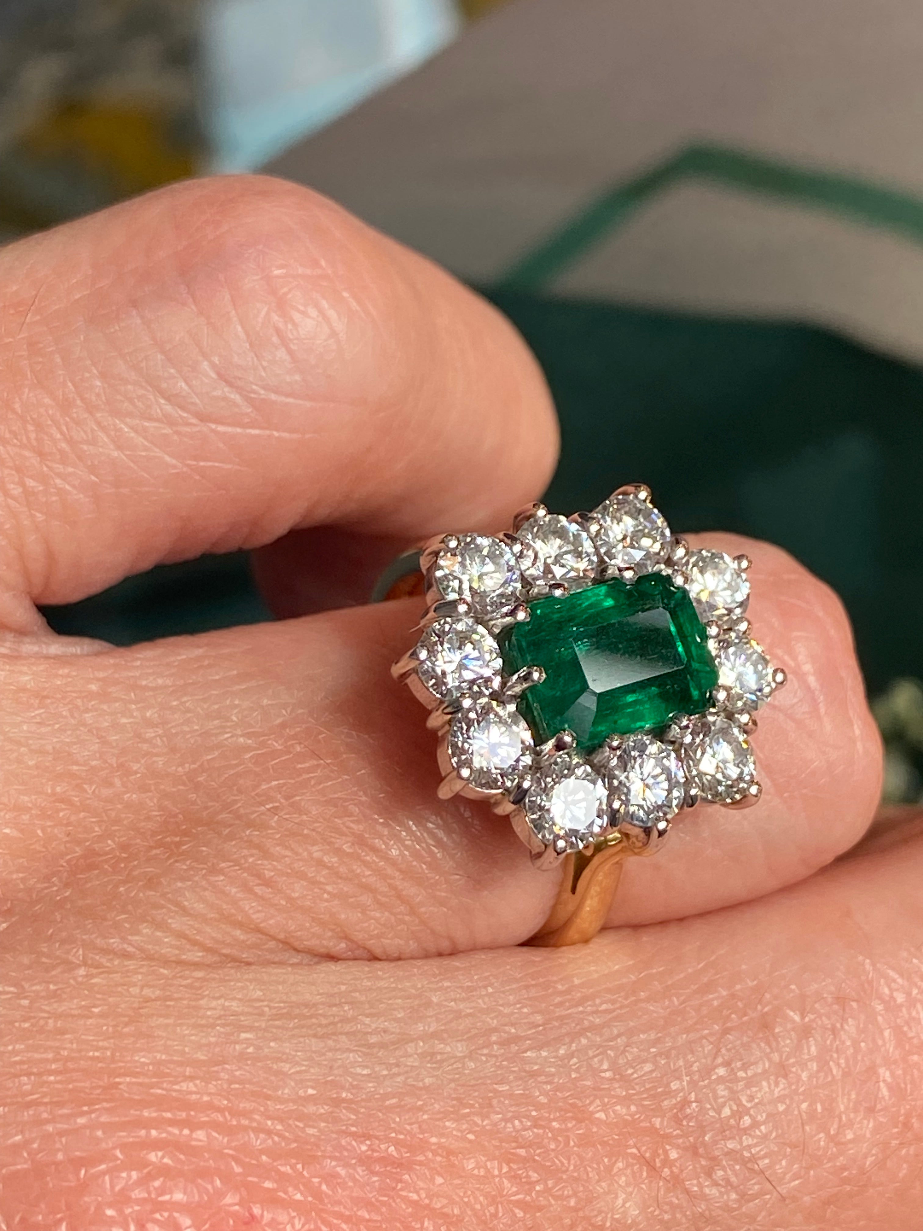 Outrageously Fantastic 4.17 CTW Emerald and Diamond Halo Ring in 18ct White and Yellow Gold