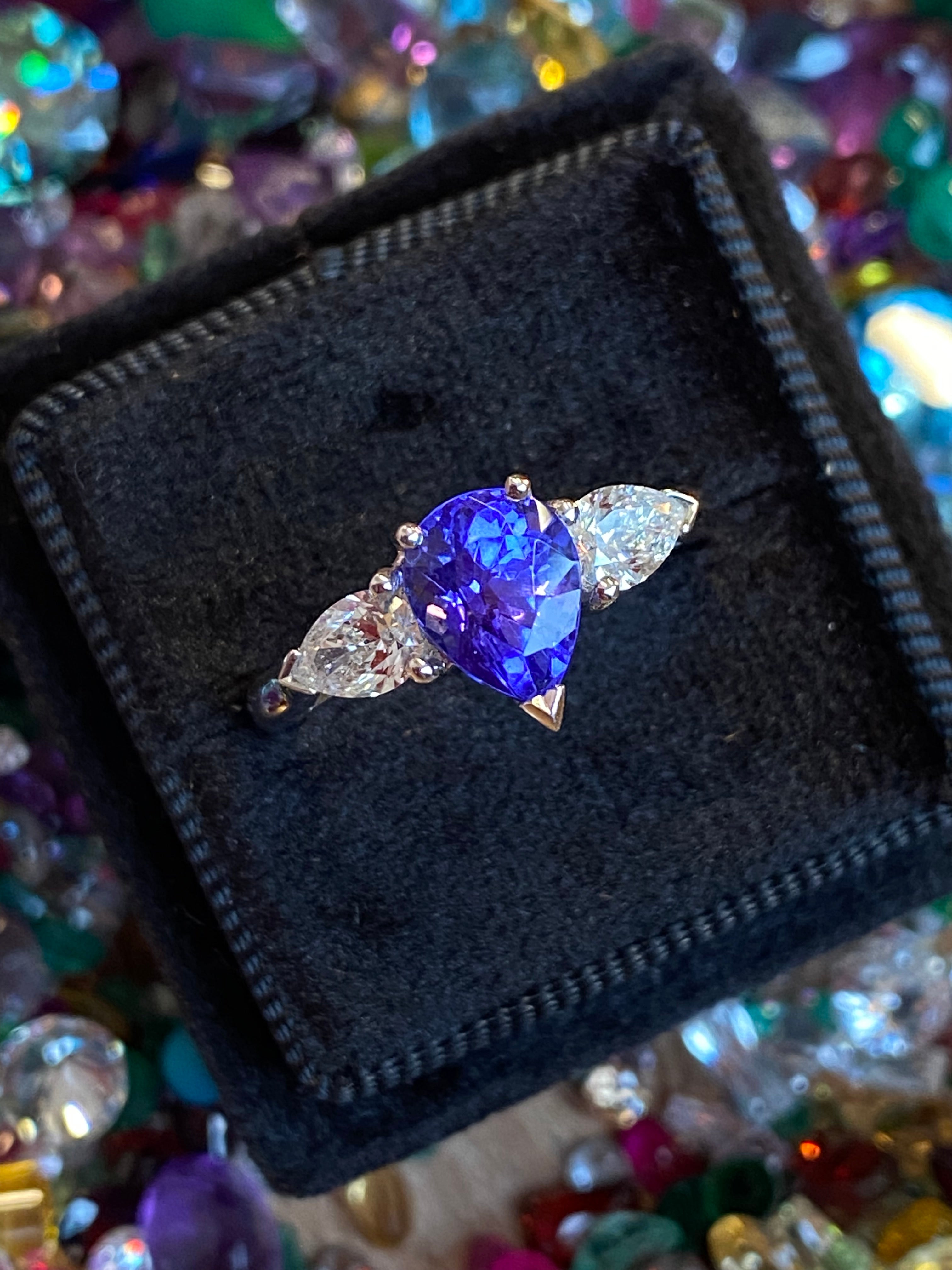 2.47 CTW Pear Cut Tanzanite and Natural Diamond Three Stone Ring in Platinum