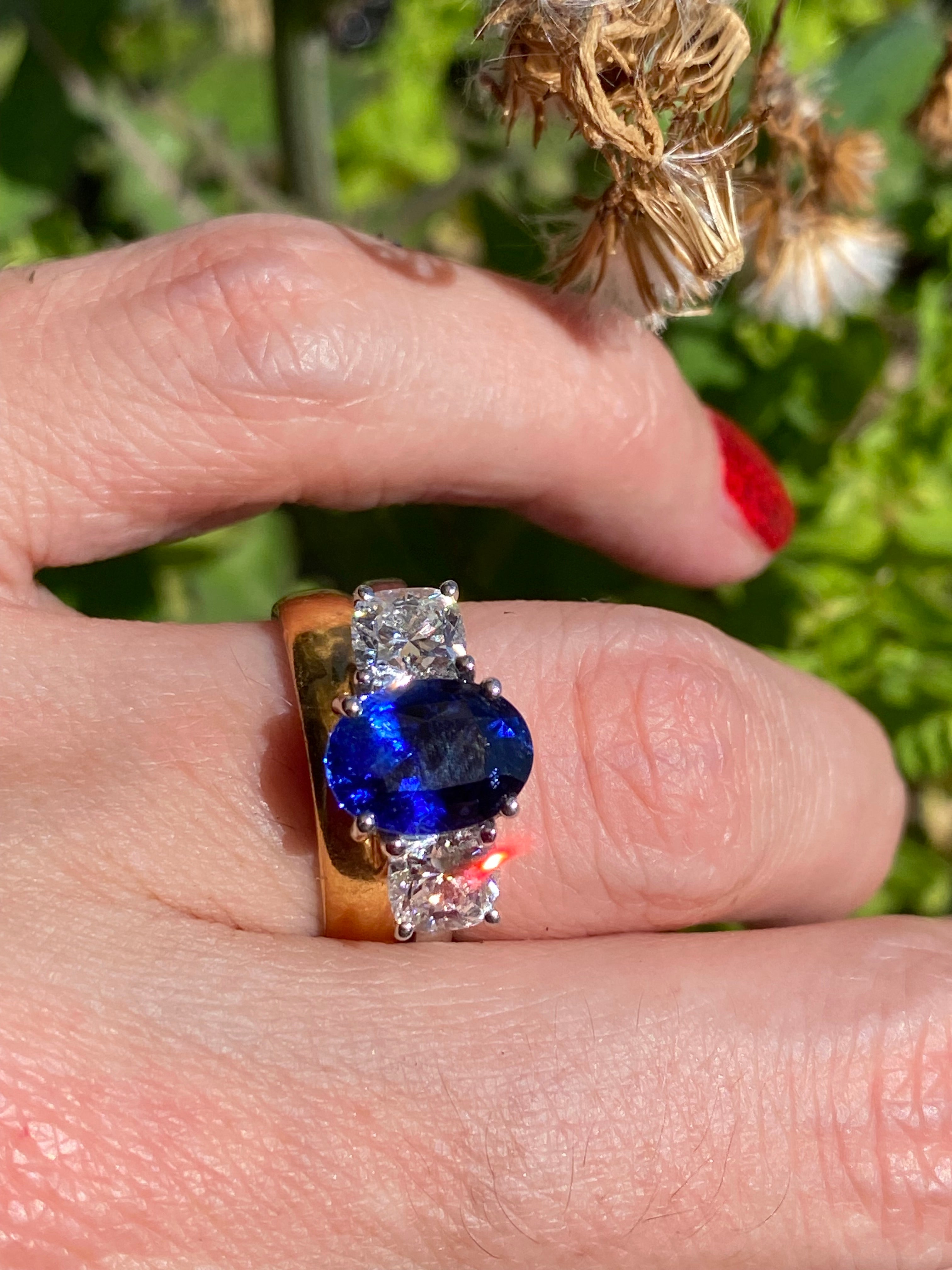 4.33 CTW Blue Ceylon Sapphire and Natural Diamond Three Stone Engagement Ring in Platinum