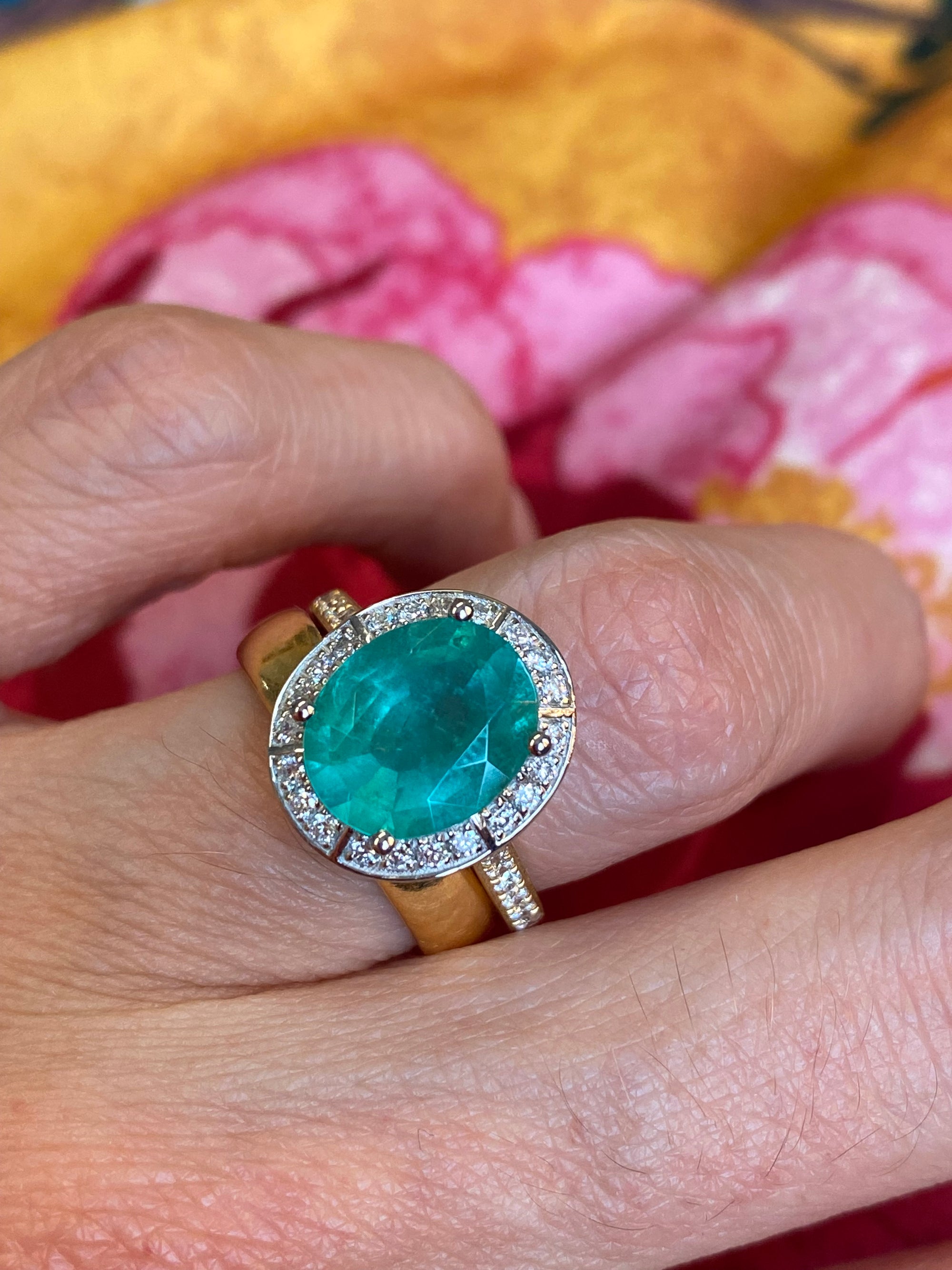 3.21 CTW Oval Cut Emerald and Natural Diamond Halo Engagement Ring in Platinum and 18ct Yellow Gold