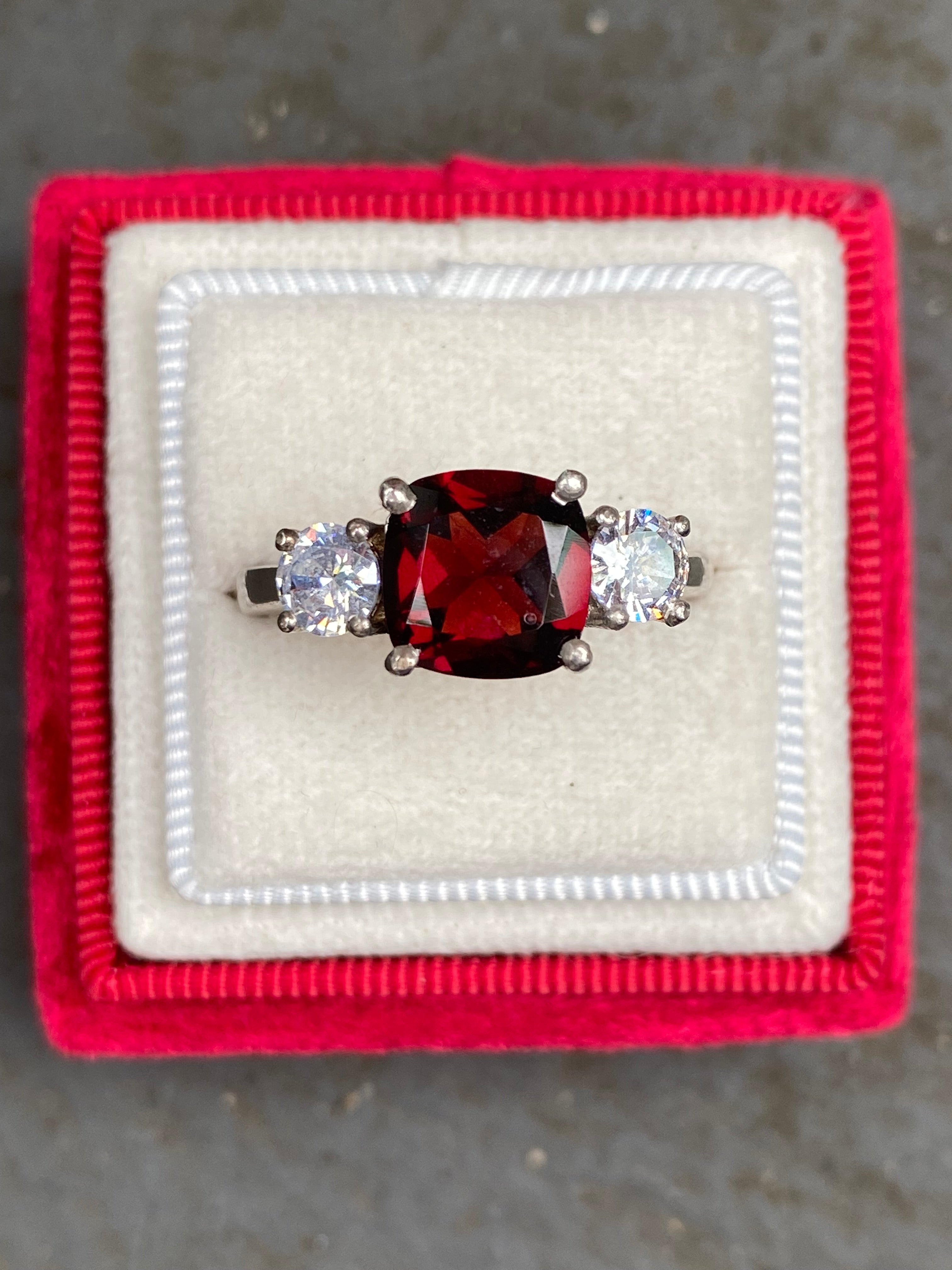 4.00 CTW Cushion Cut Garnet and Moissanite Three Stone Ring in Sterling Silver