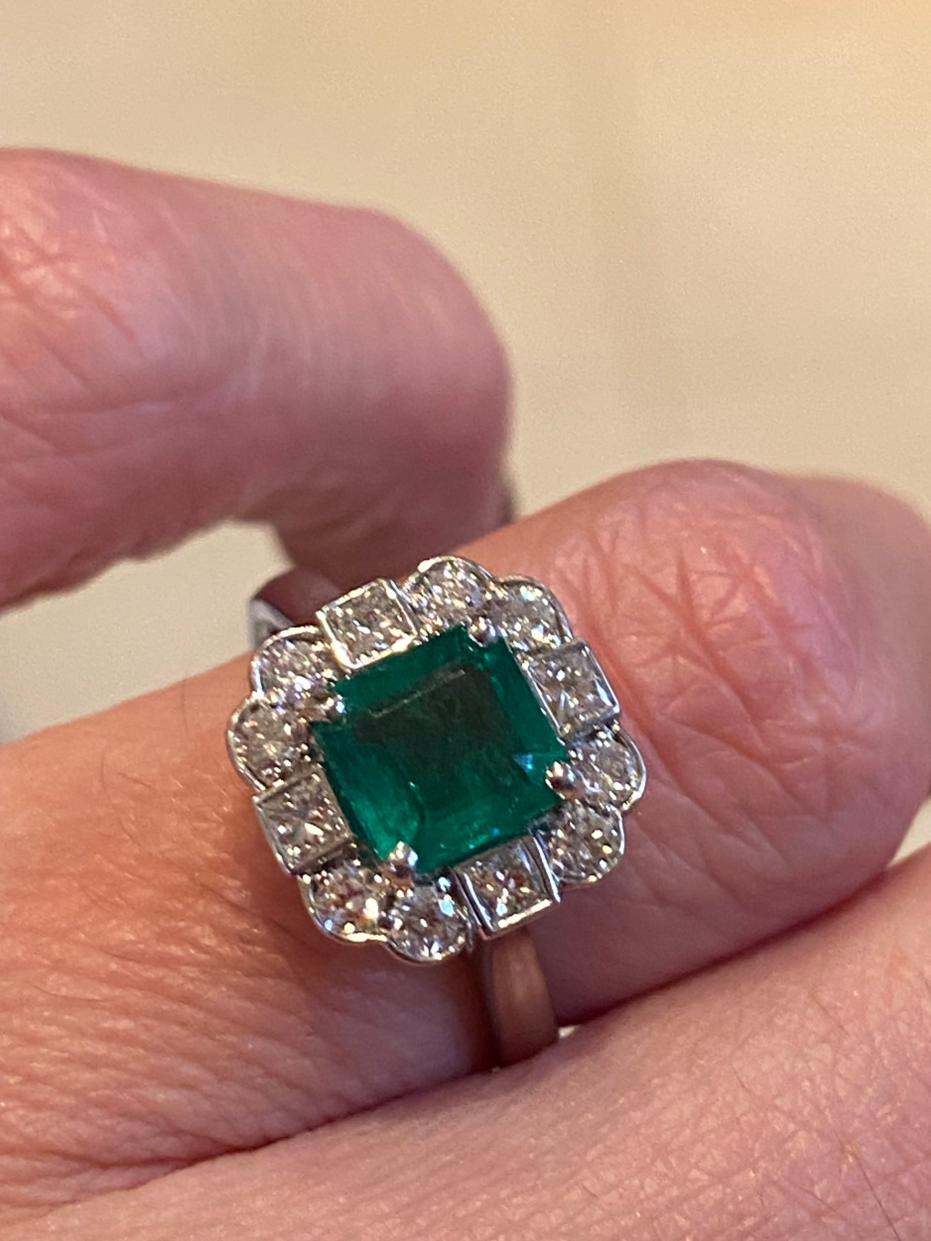 1.35 Carat Emerald Cut Emerald and 0.49 CTW Natural Diamond Halo Ring in Platinum