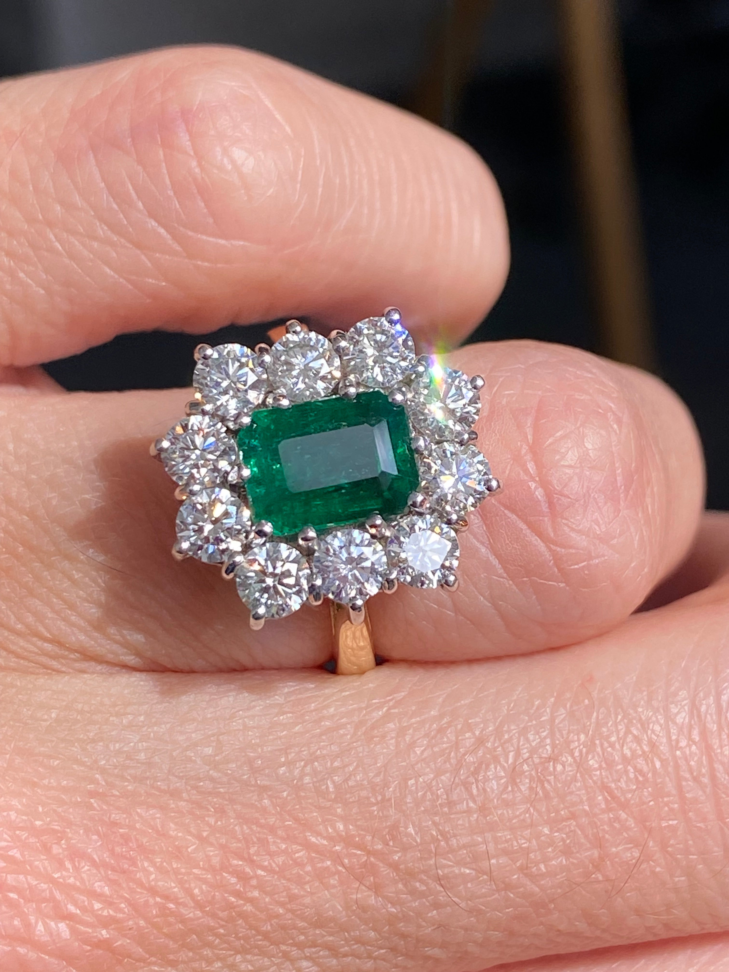 Outrageously Fantastic 4.17 CTW Emerald and Diamond Halo Ring in 18ct White and Yellow Gold