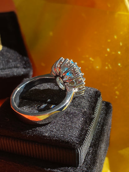 4.50 CTW Oval Cut Blue Topaz and Moissanite Halo Cluster Ring in Sterling Silver