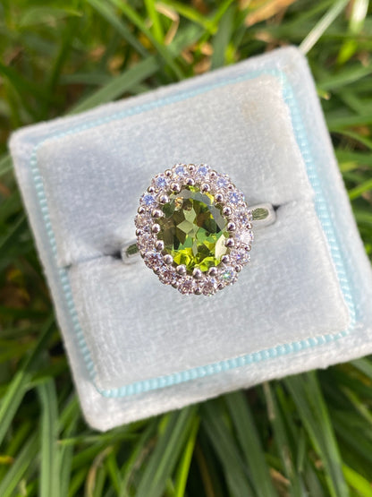 2.33 CTW Oval Cut Peridot and Moissanite Halo Cocktail Ring in Sterling Silver
