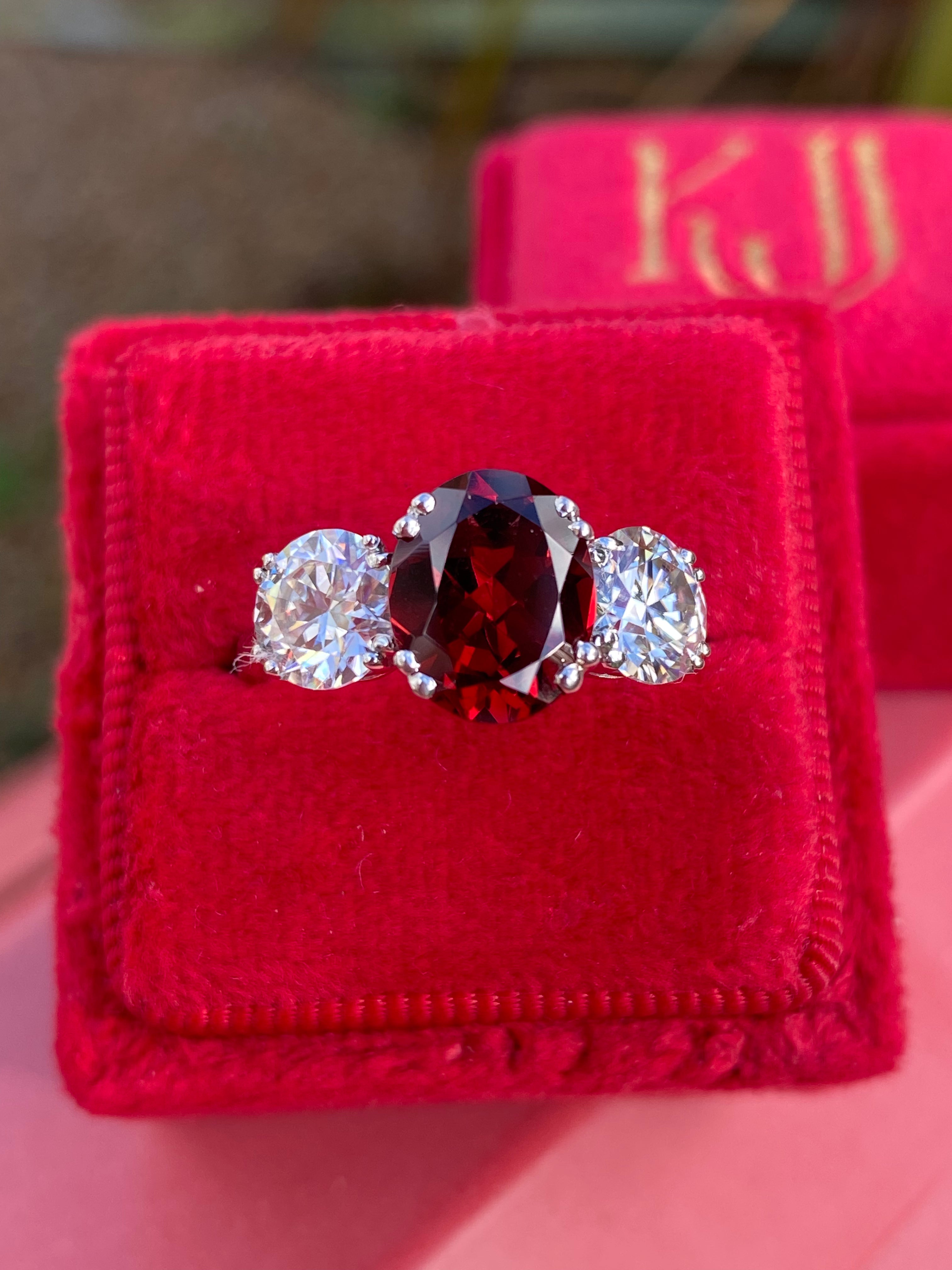 2.57 Carat Garnet and 1.84 Carat Moissanite Three Stone Ring in Sterling Silver