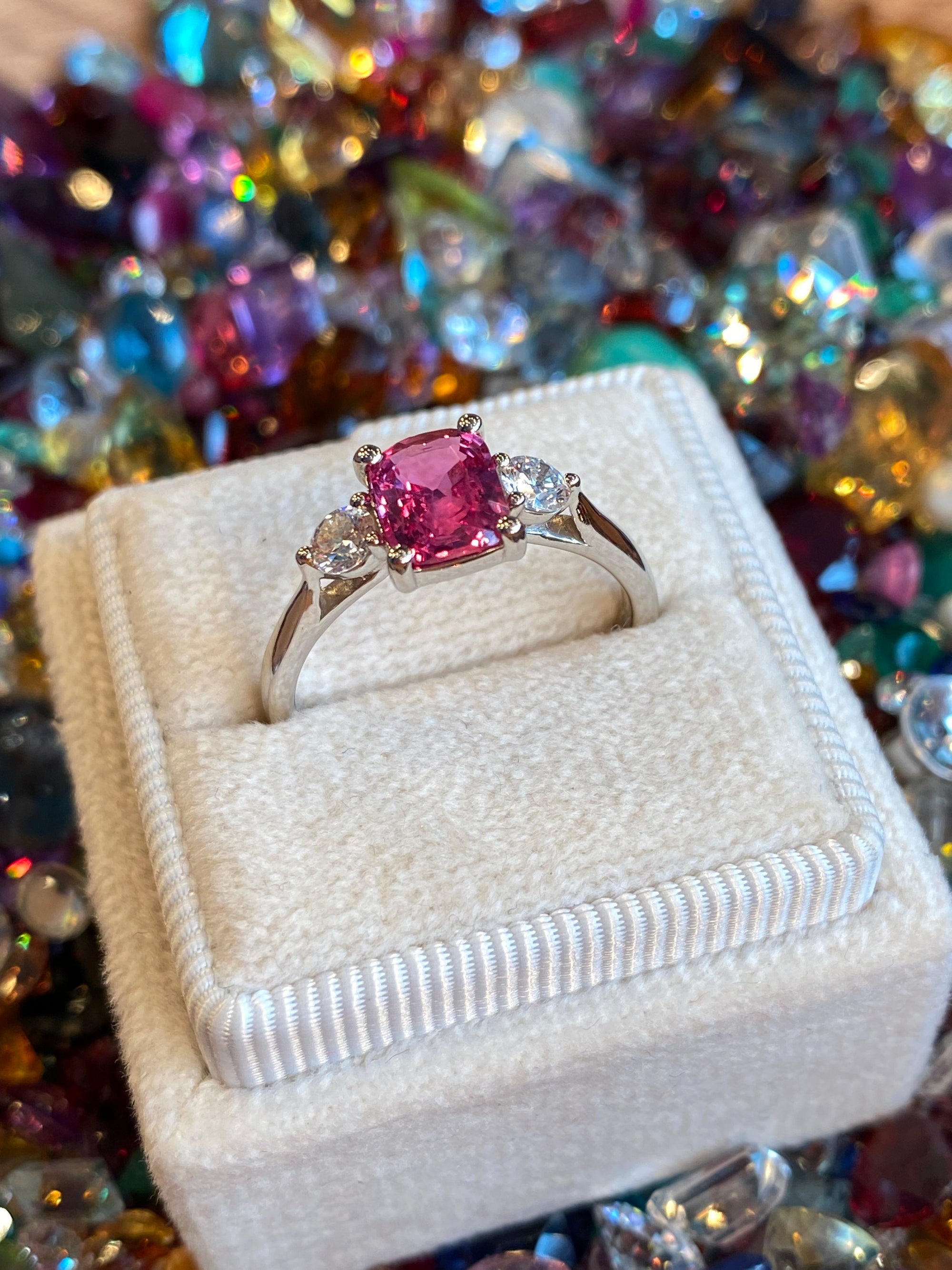1.52 CTW Cushion Cut Ruby and Natural Diamond Three-Stone Engagement Ring in Platinum