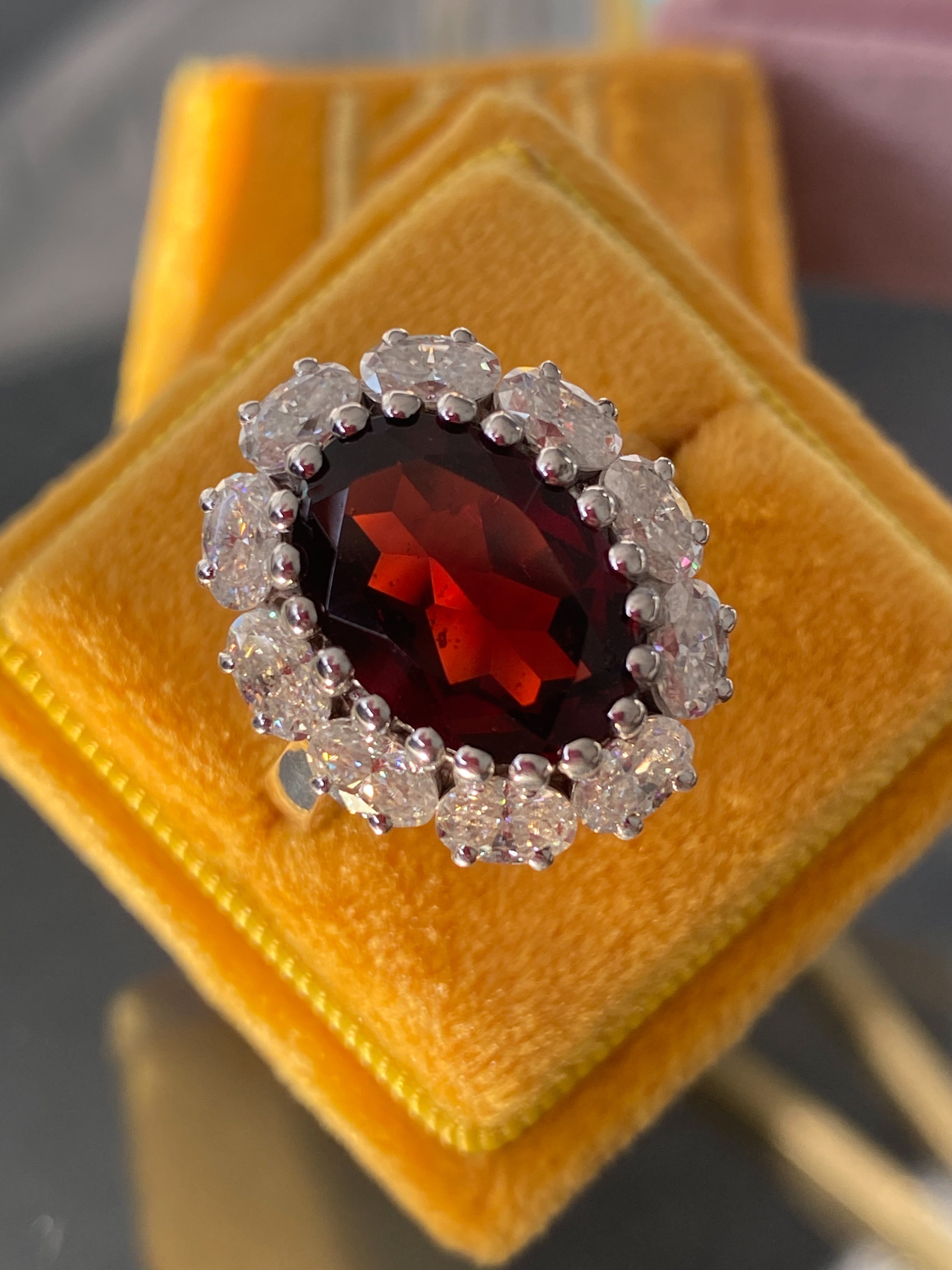 7.25 CTW Oval Cut Garnet and Moissanite Halo Cocktail Ring in Sterling Silver