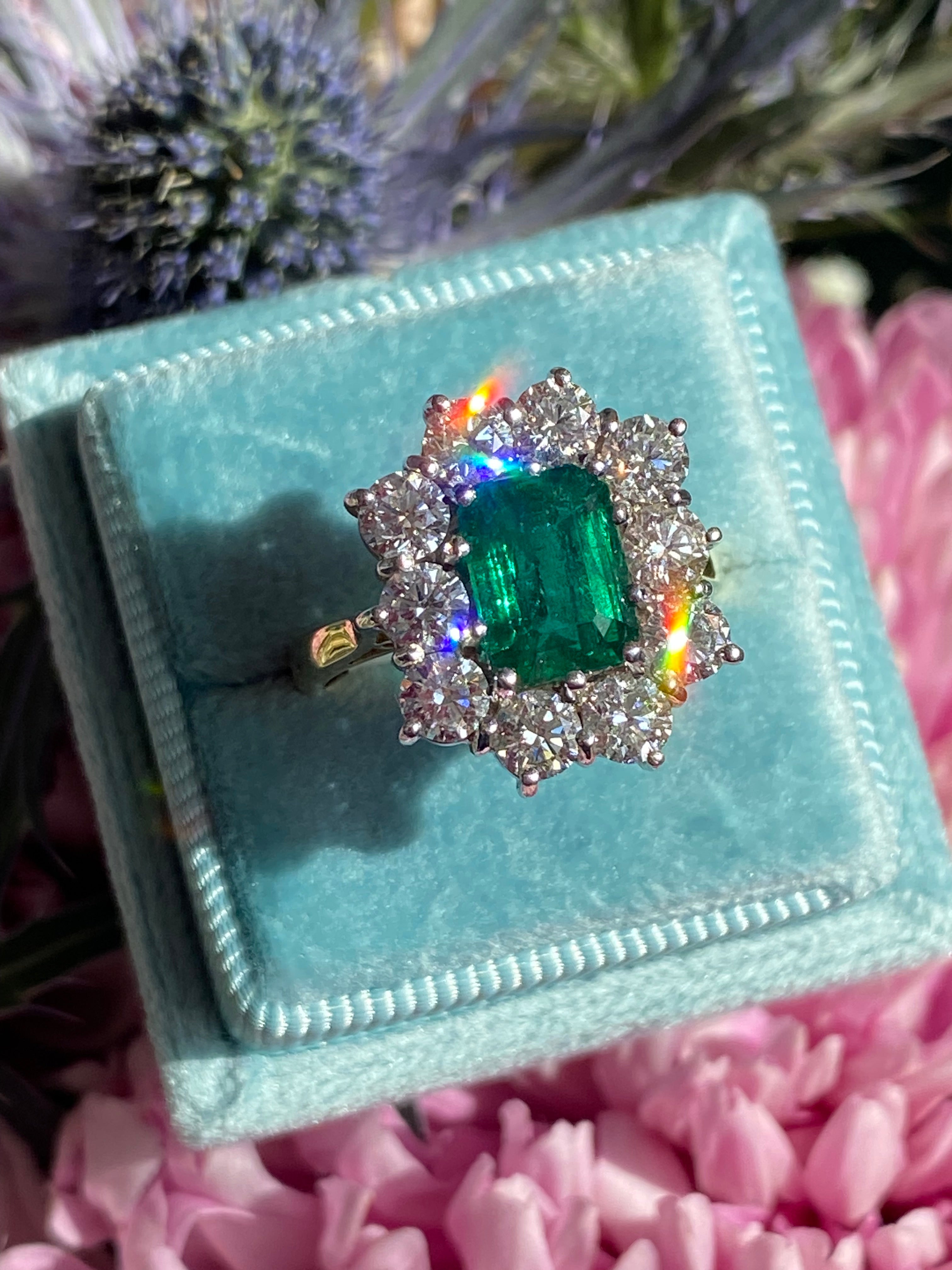 Outrageously Fantastic 4.17 CTW Emerald and Diamond Halo Ring in 18ct White and Yellow Gold