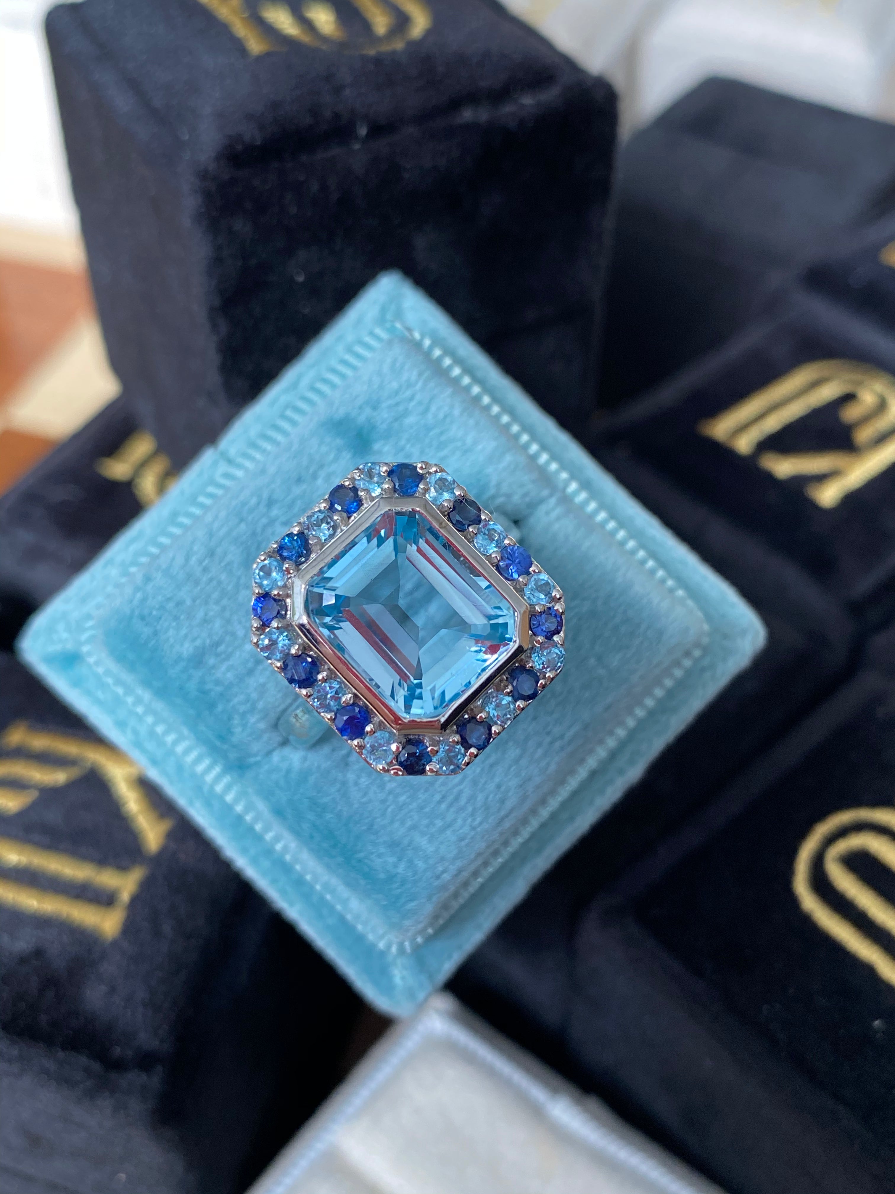 Blue Topaz and Blue Sapphire Halo Cocktail Ring in Sterling Silver