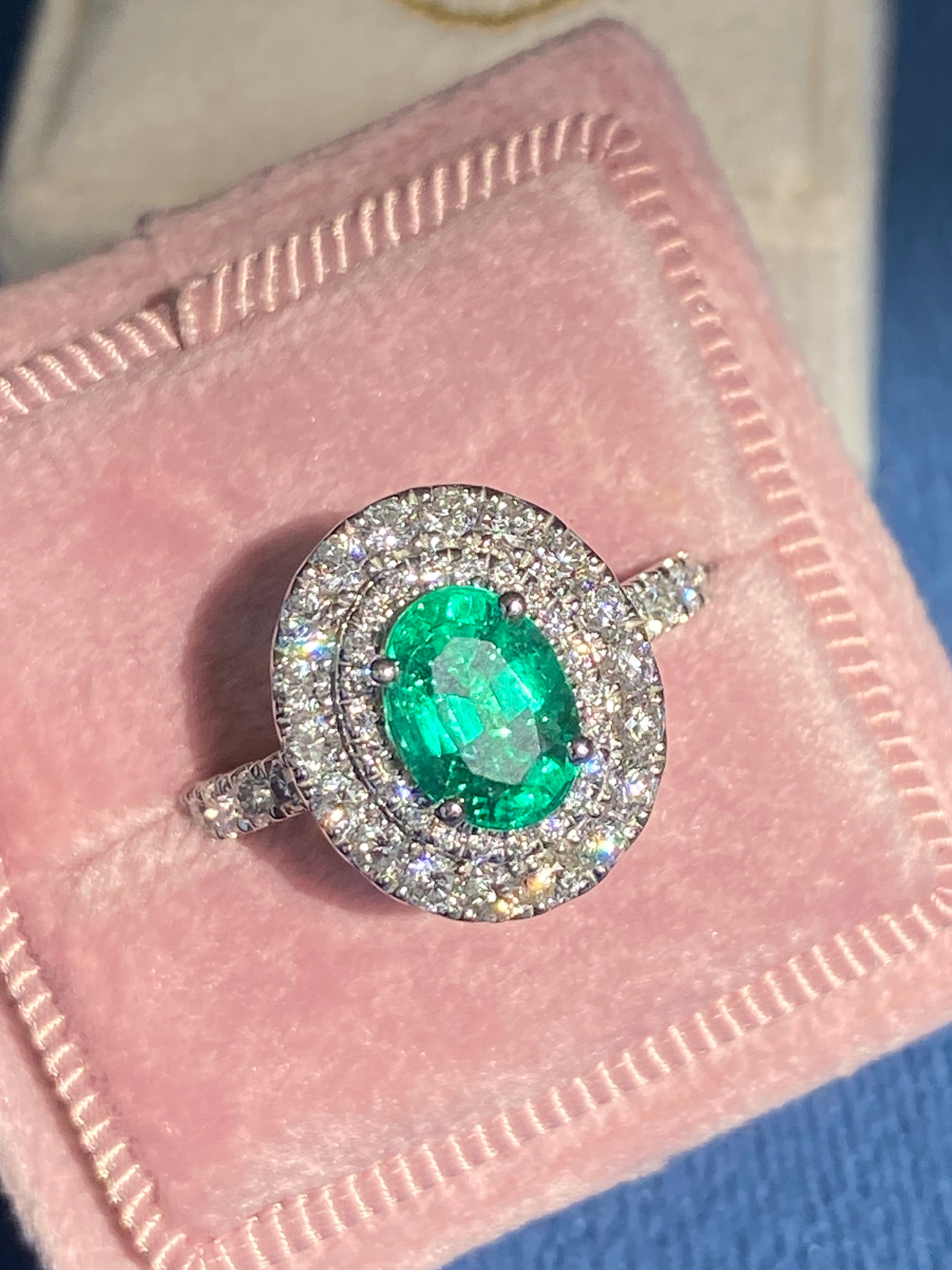 2.11 CTW Oval Cut Emerald and Natural Diamond Double Halo Ring in Platinum