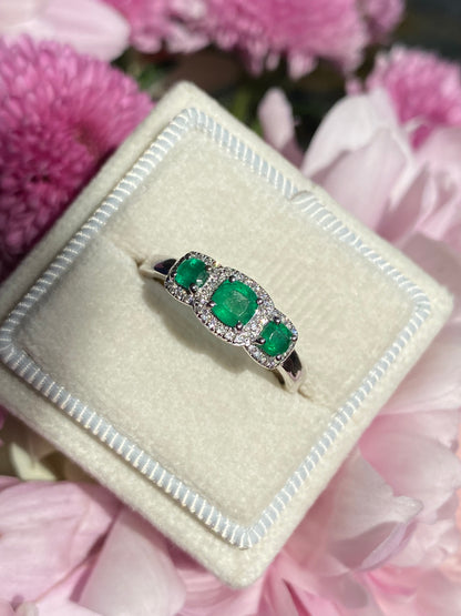 0.65ctw Emerald and Diamond Three Stone Halo Ring in Platinum