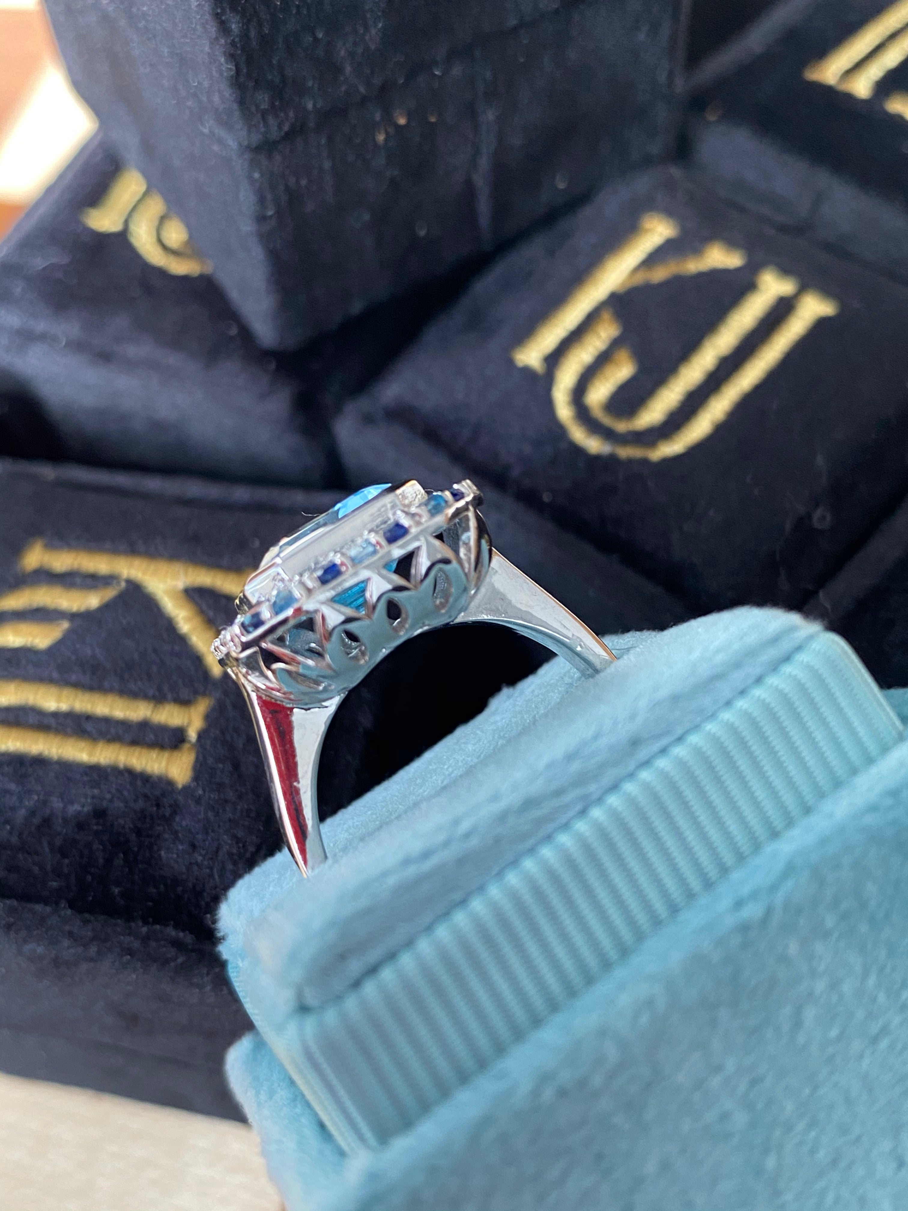 Blue Topaz and Blue Sapphire Halo Cocktail Ring in Sterling Silver