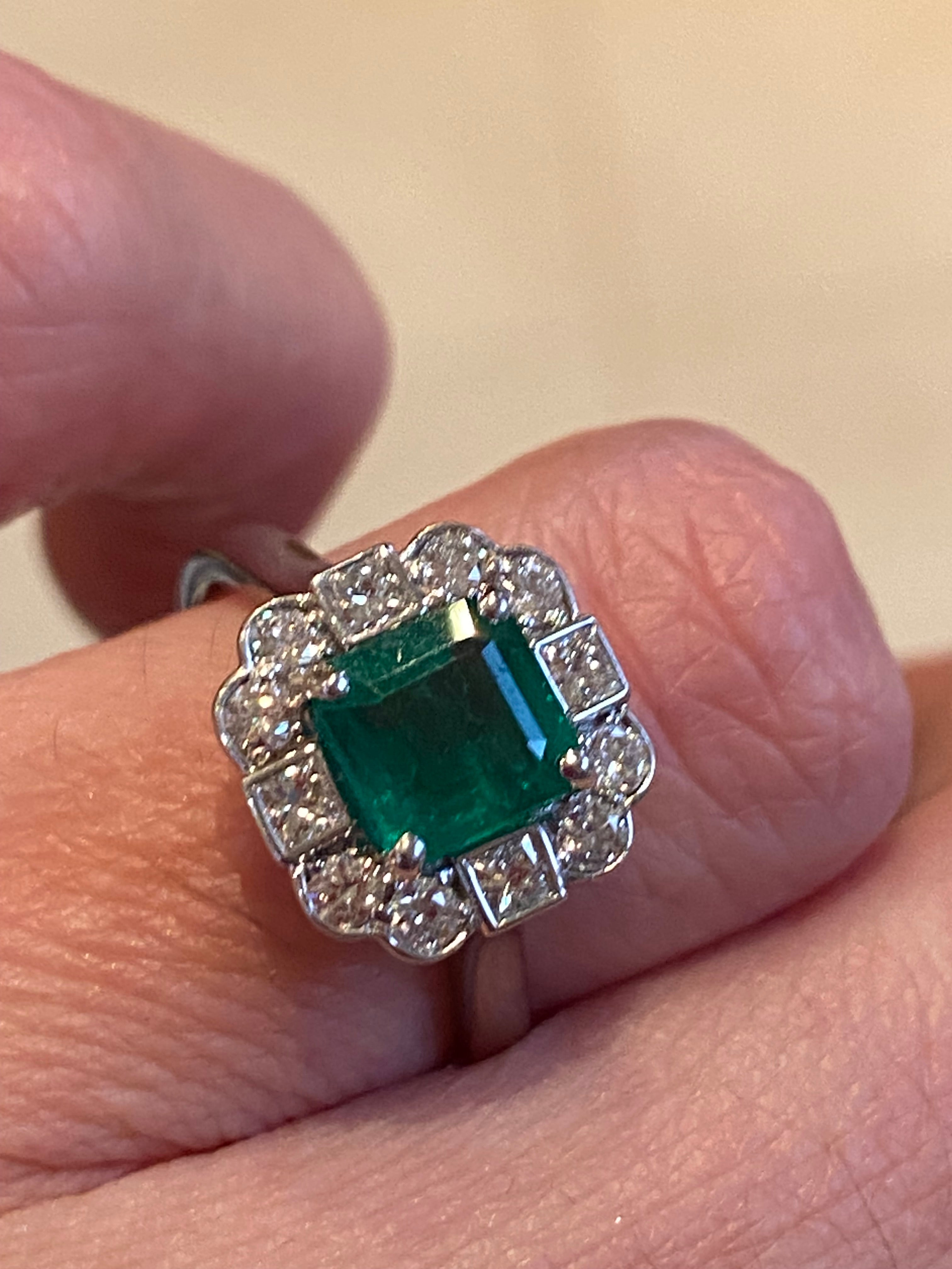 1.35 Carat Emerald Cut Emerald and 0.49 CTW Natural Diamond Halo Ring in Platinum