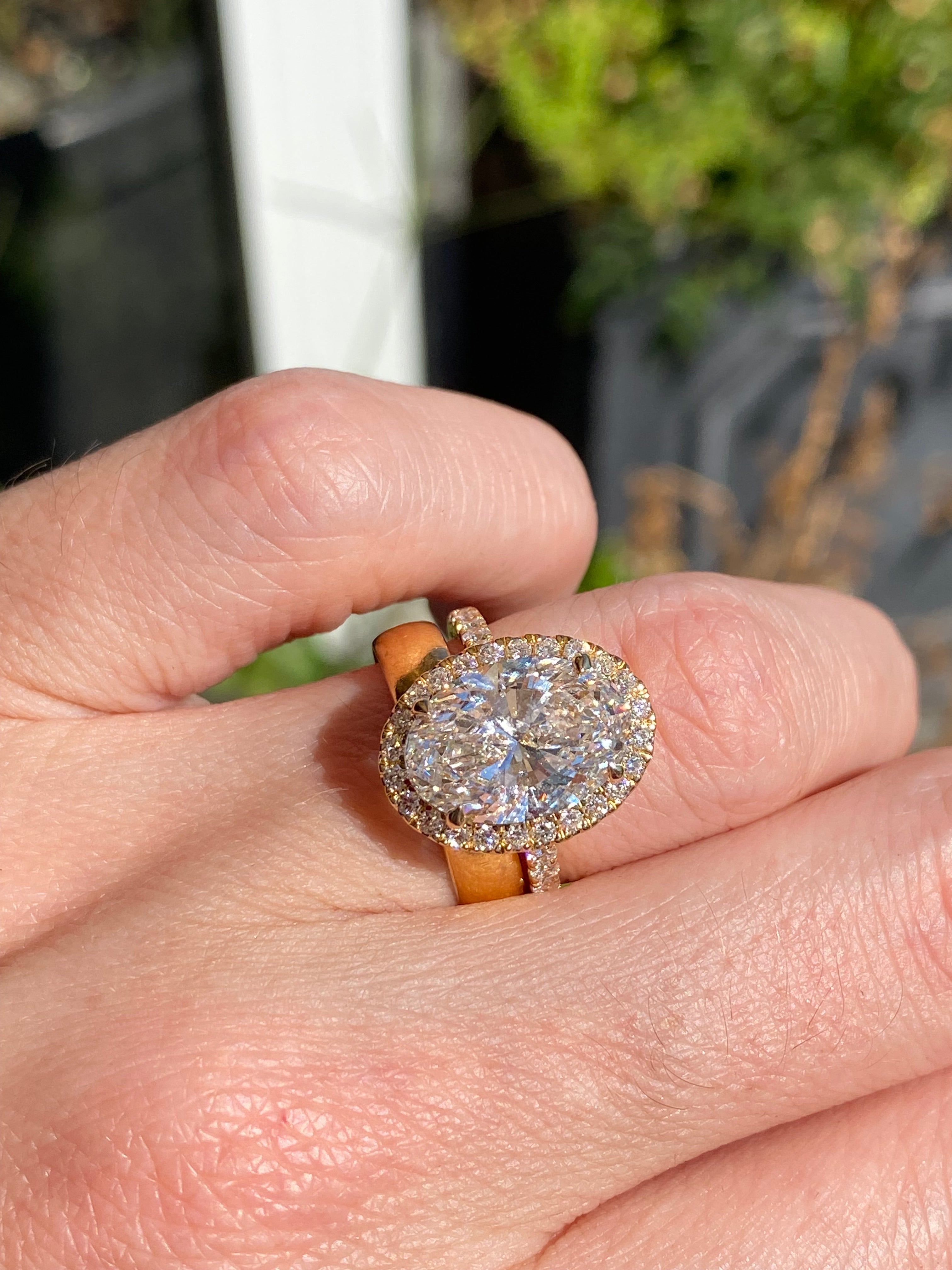 4.59 CTW Oval Cut Lab Diamond Halo Engagement Ring in 18ct Yellow Gold